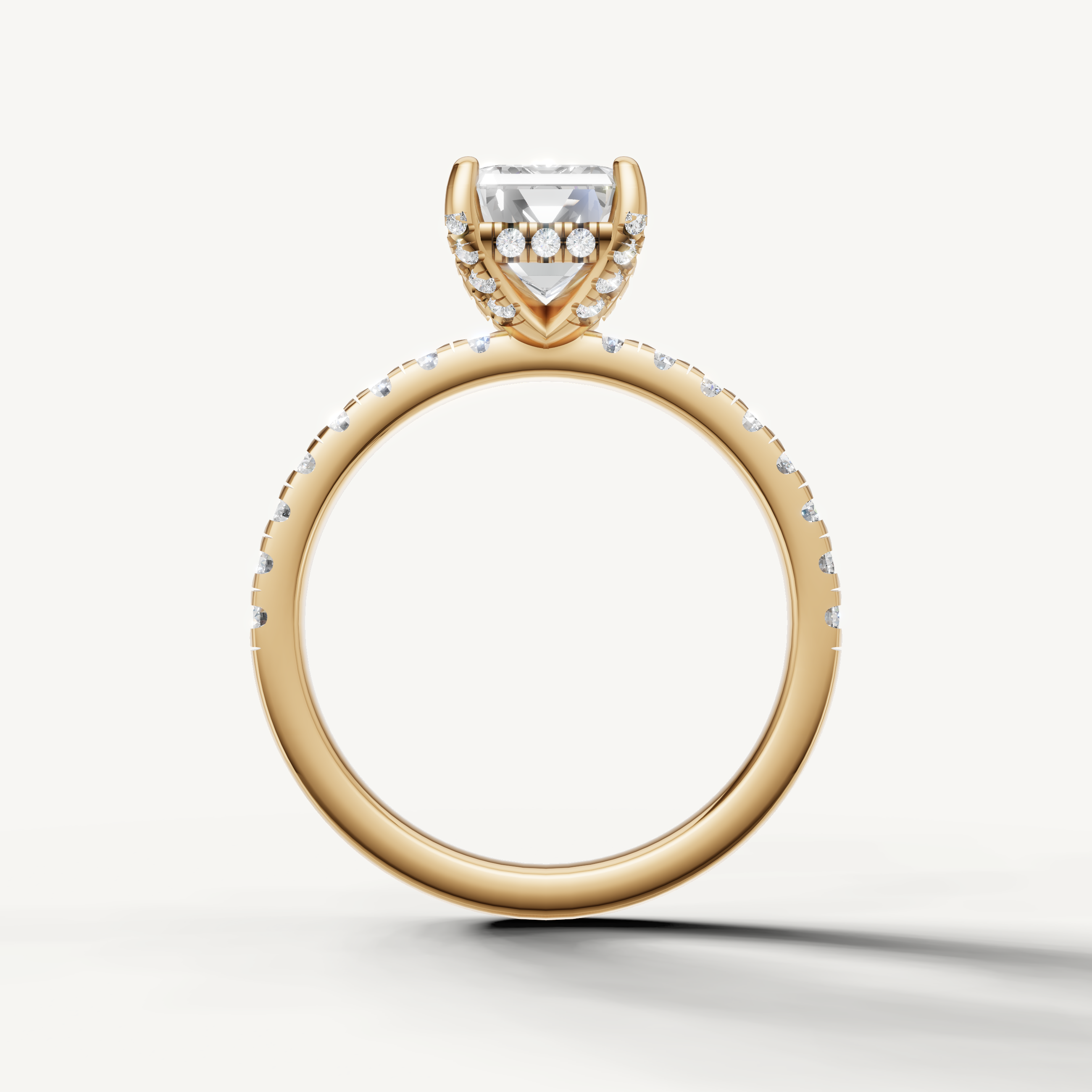 Emerald shape lab grown diamond ring with half pavé band yellow gold