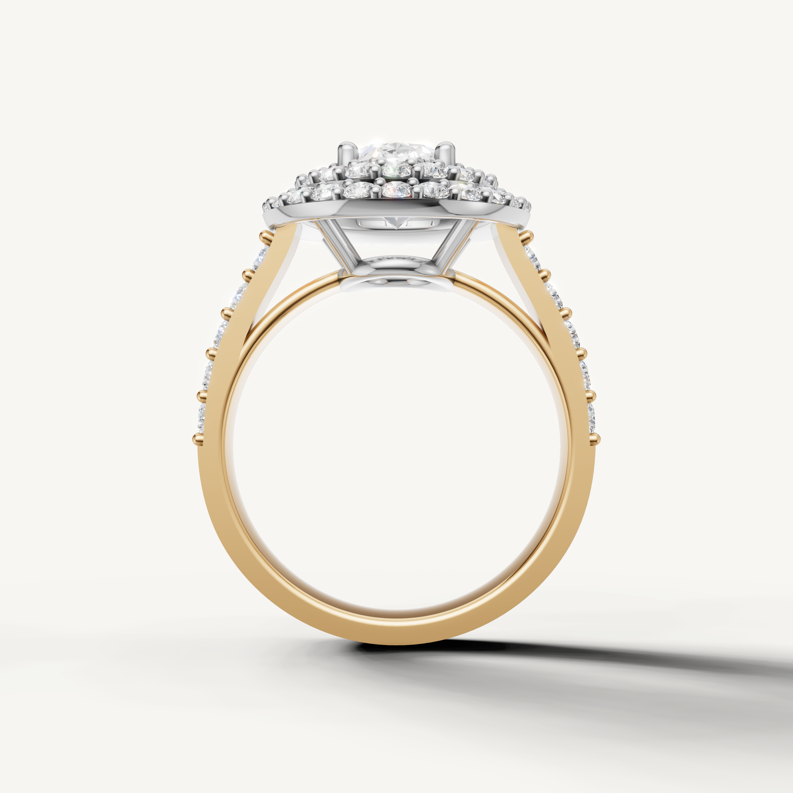 Elegant yellow gold oval halo ring with side diamonds by Raul Diamonds
