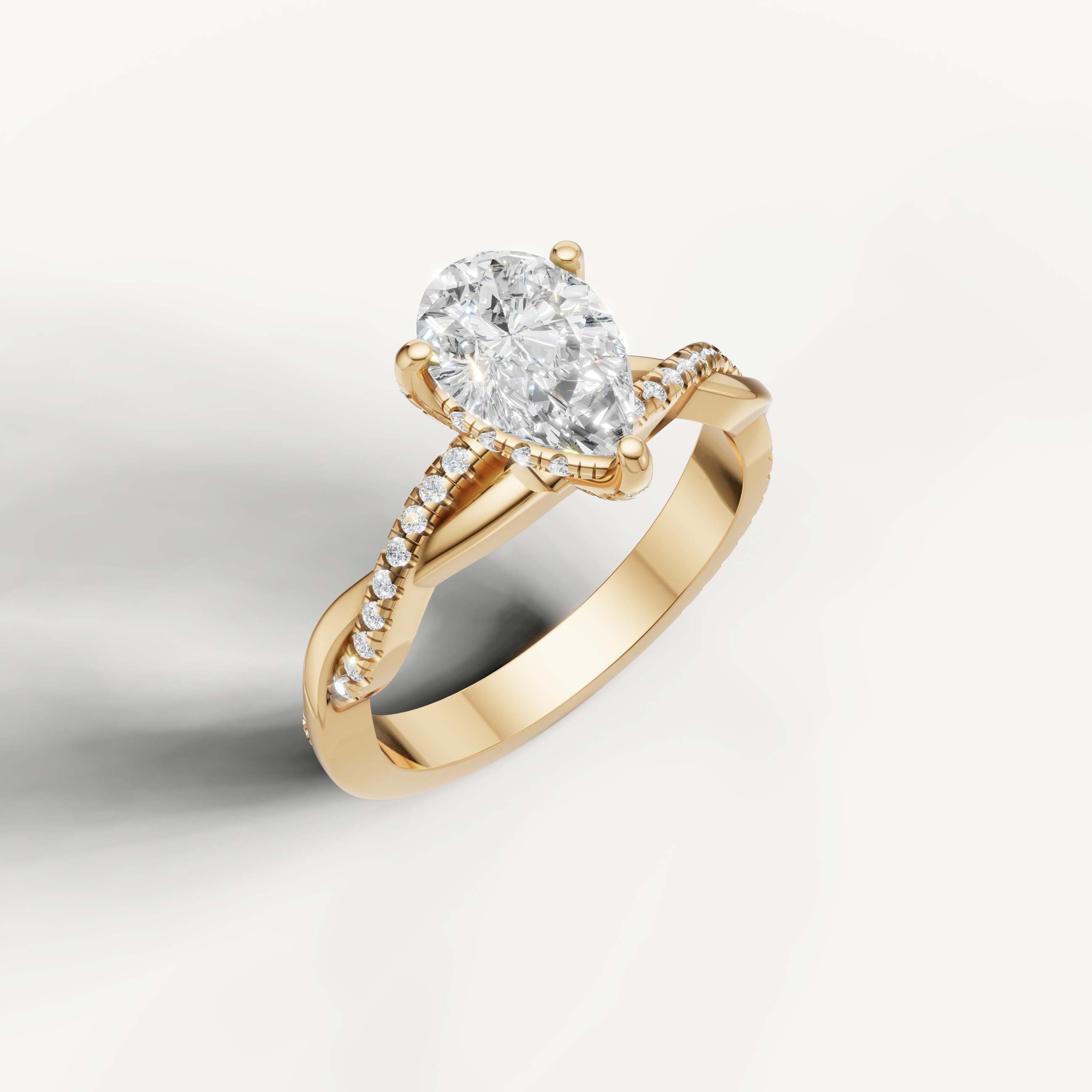 elegant pear shaped lab grown diamond engagement ring in 14k yellow gold with twisted pavé split shank