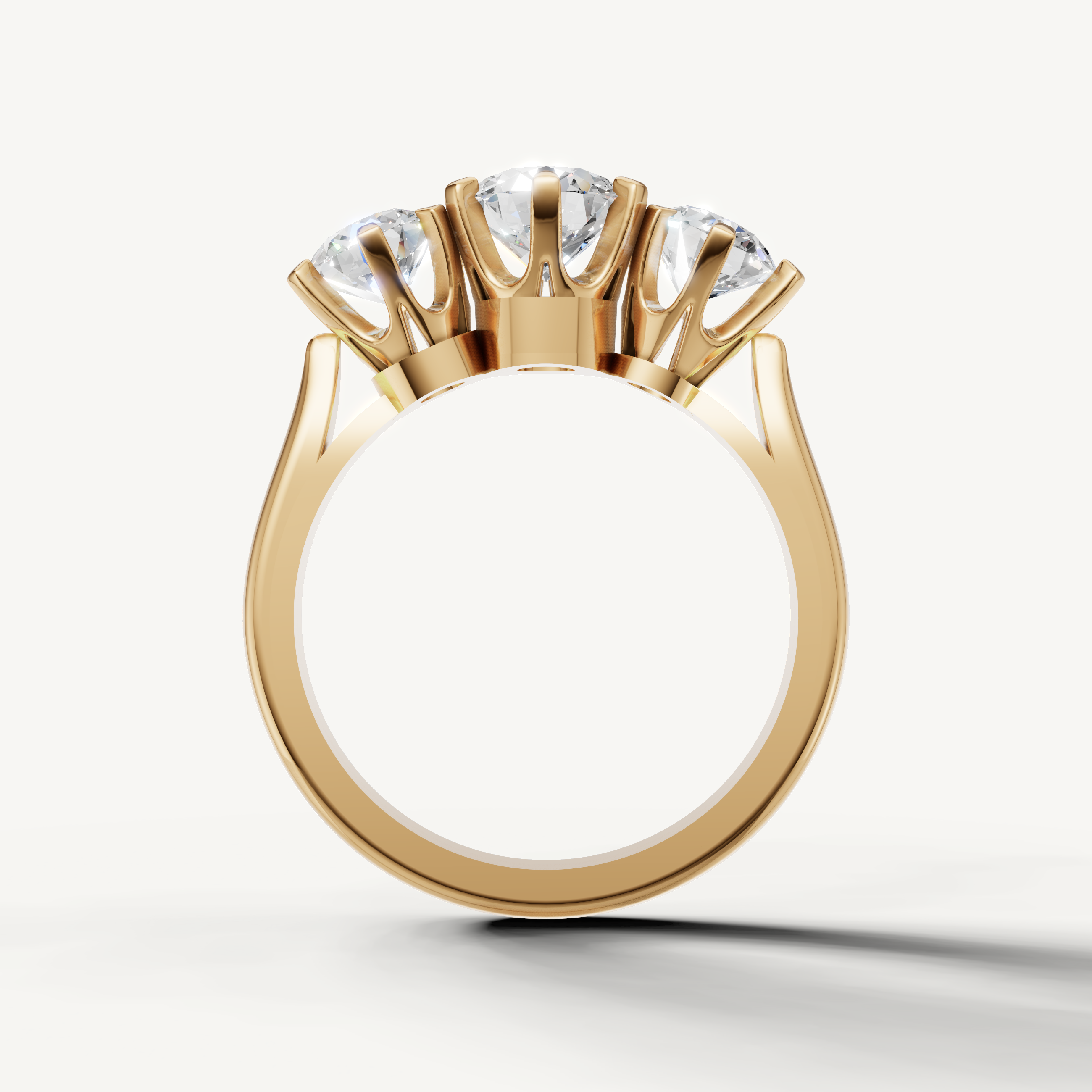 Elegant yellow gold round three stone ring with classic setting by Raul Diamonds
