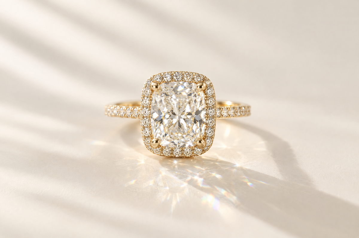 Cushion cut lab-grown diamond halo engagement ring in yellow gold