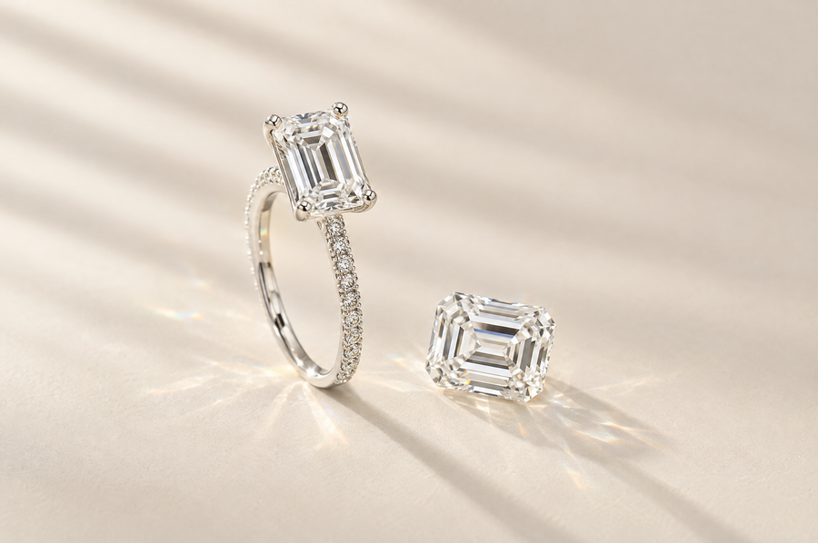 Emerald cut lab-grown diamond engagement ring beside a loose emerald cut diamond