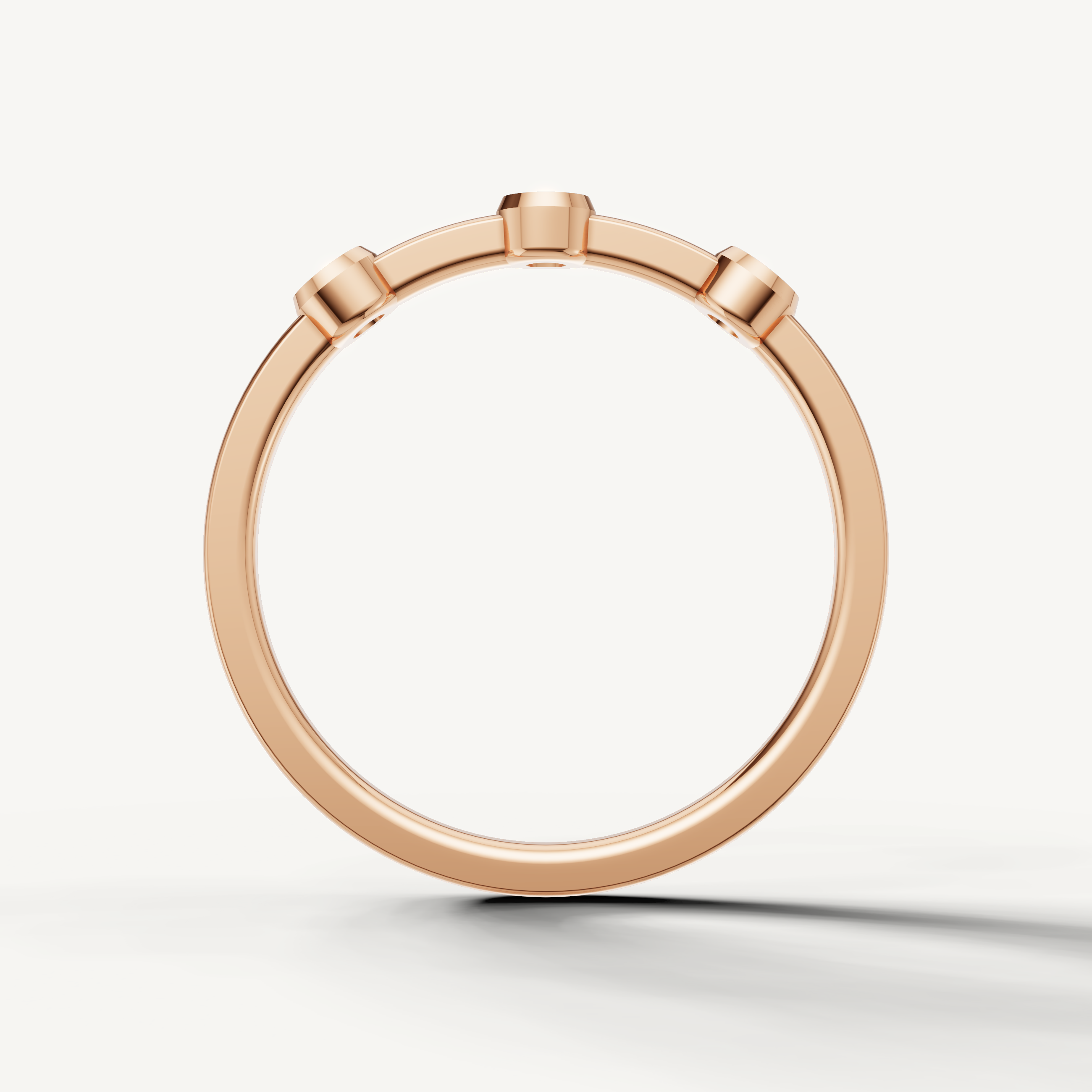 Modern rose gold anniversary wedding ring with round bezel set diamonds