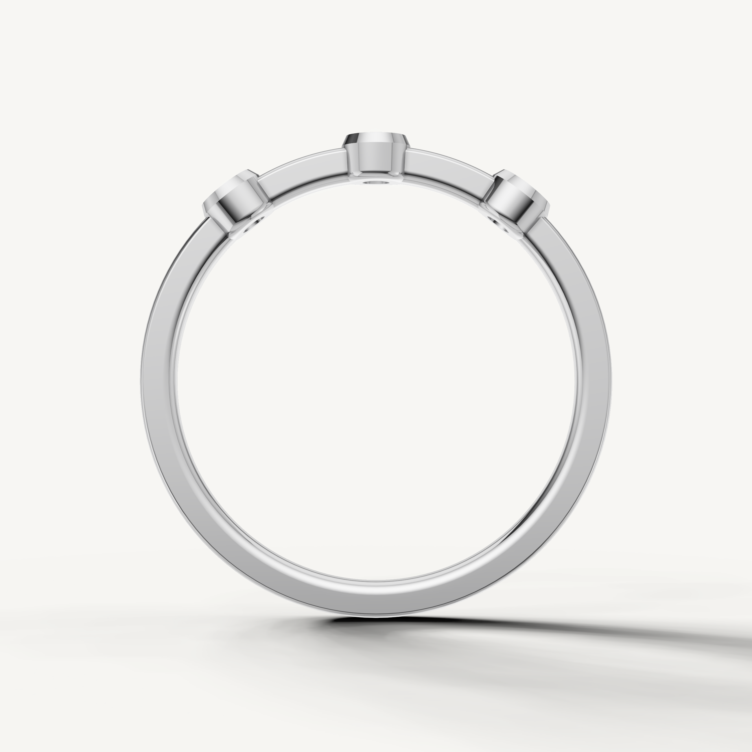 Modern white gold minimalist wedding band with round bezel diamonds