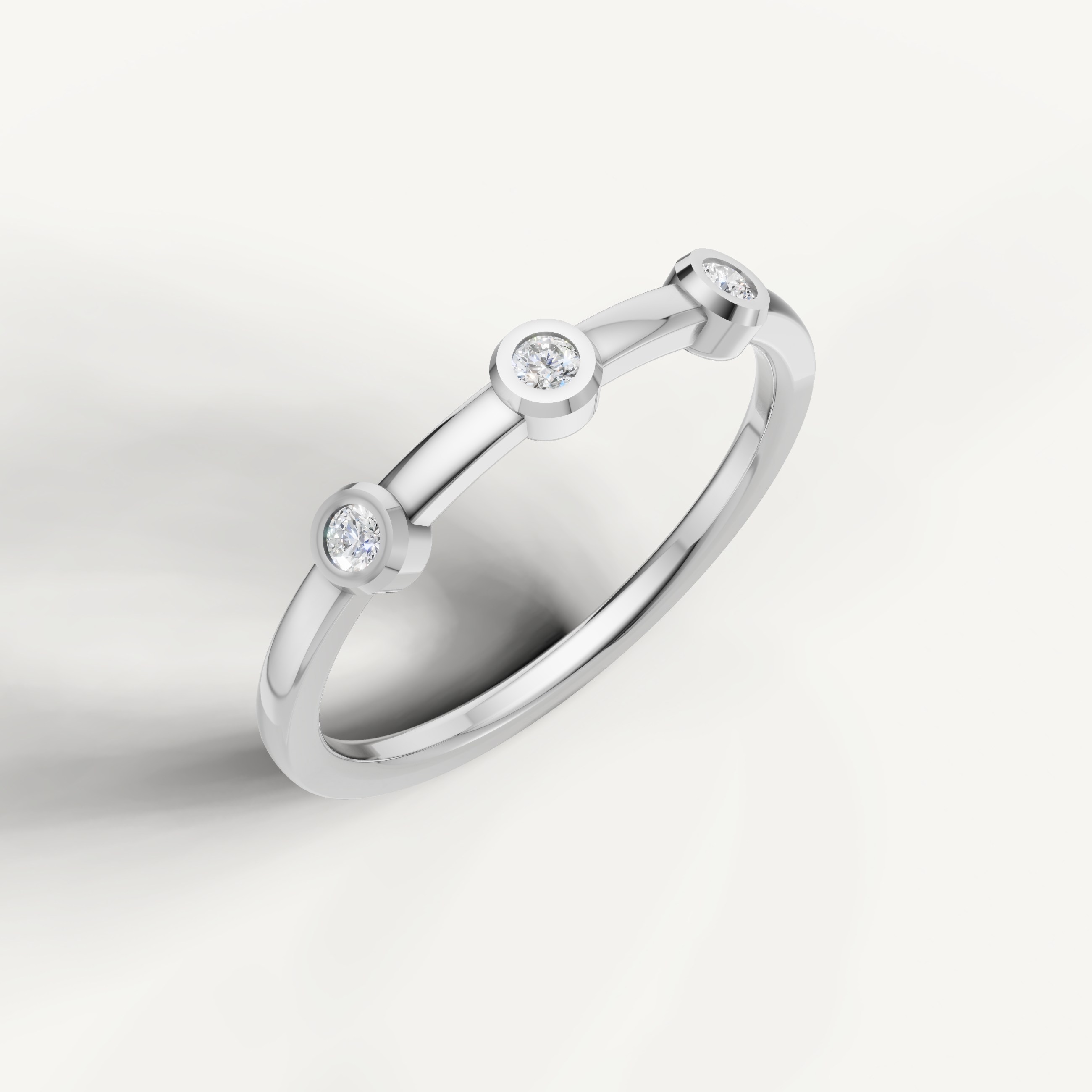 Elegant white gold three stone diamond wedding ring with polished finish
