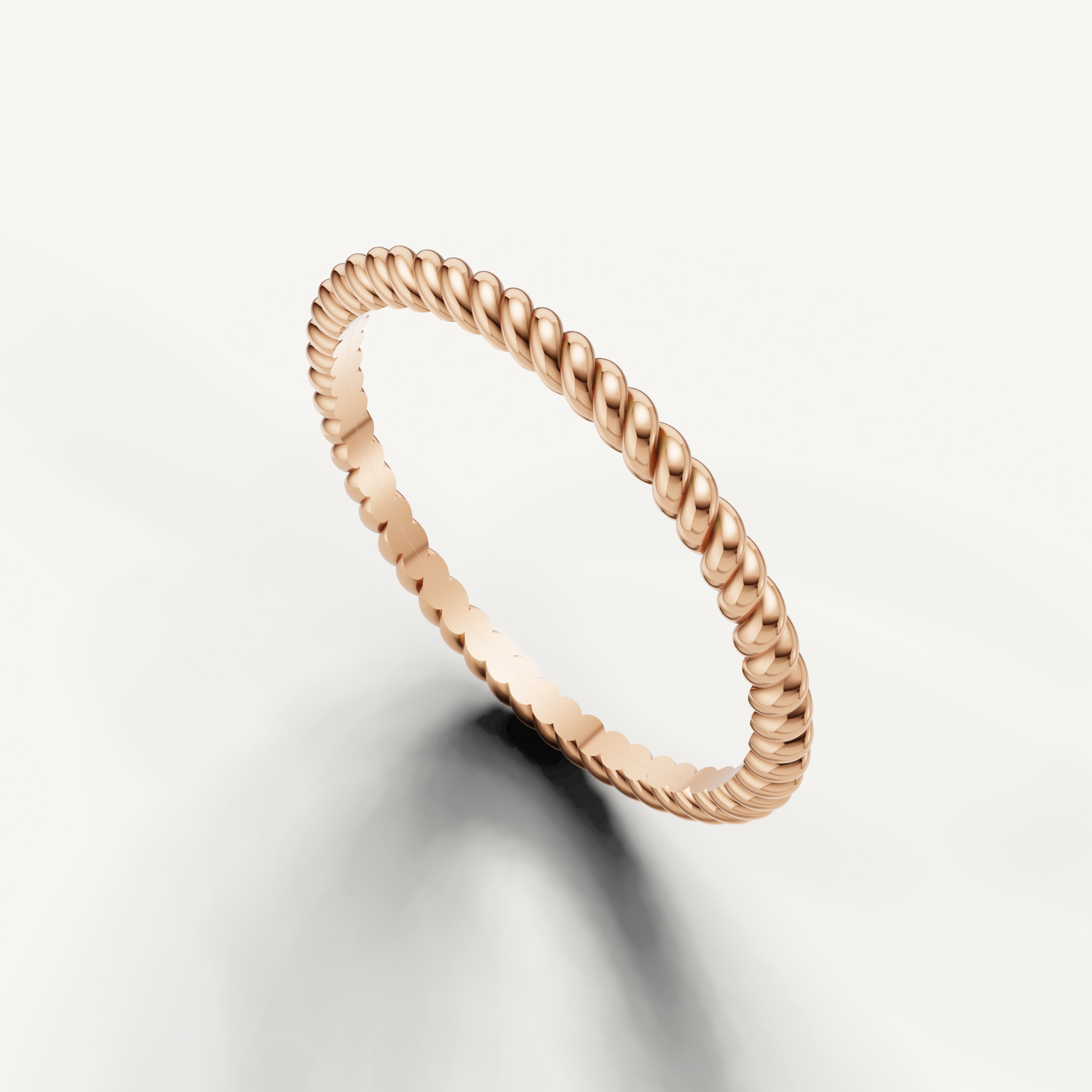Modern rose gold twisted wedding band with handcrafted rope detailing