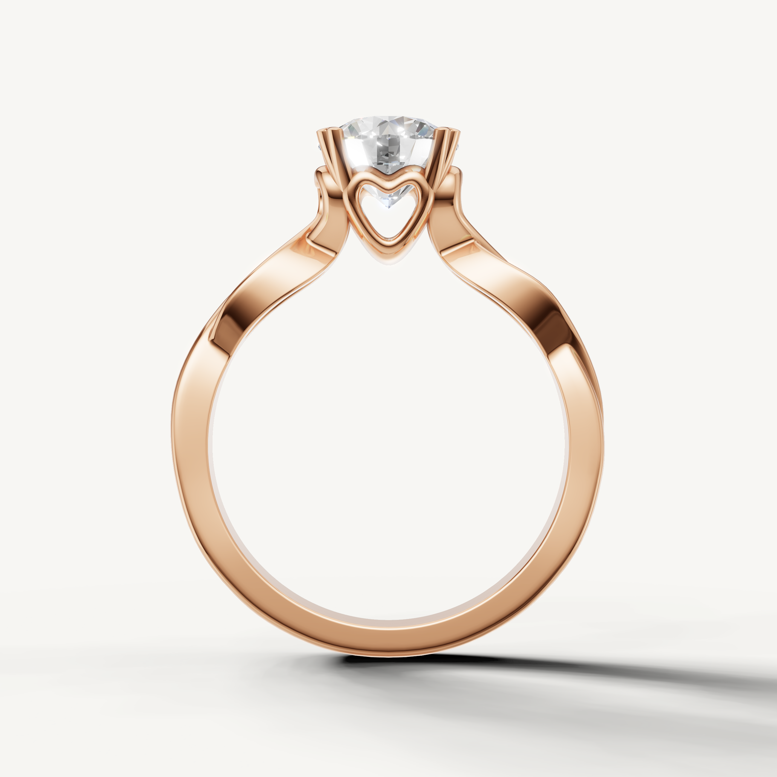 Rose gold emerald cut engagement ring with graceful flowing band by Raul Diamonds.