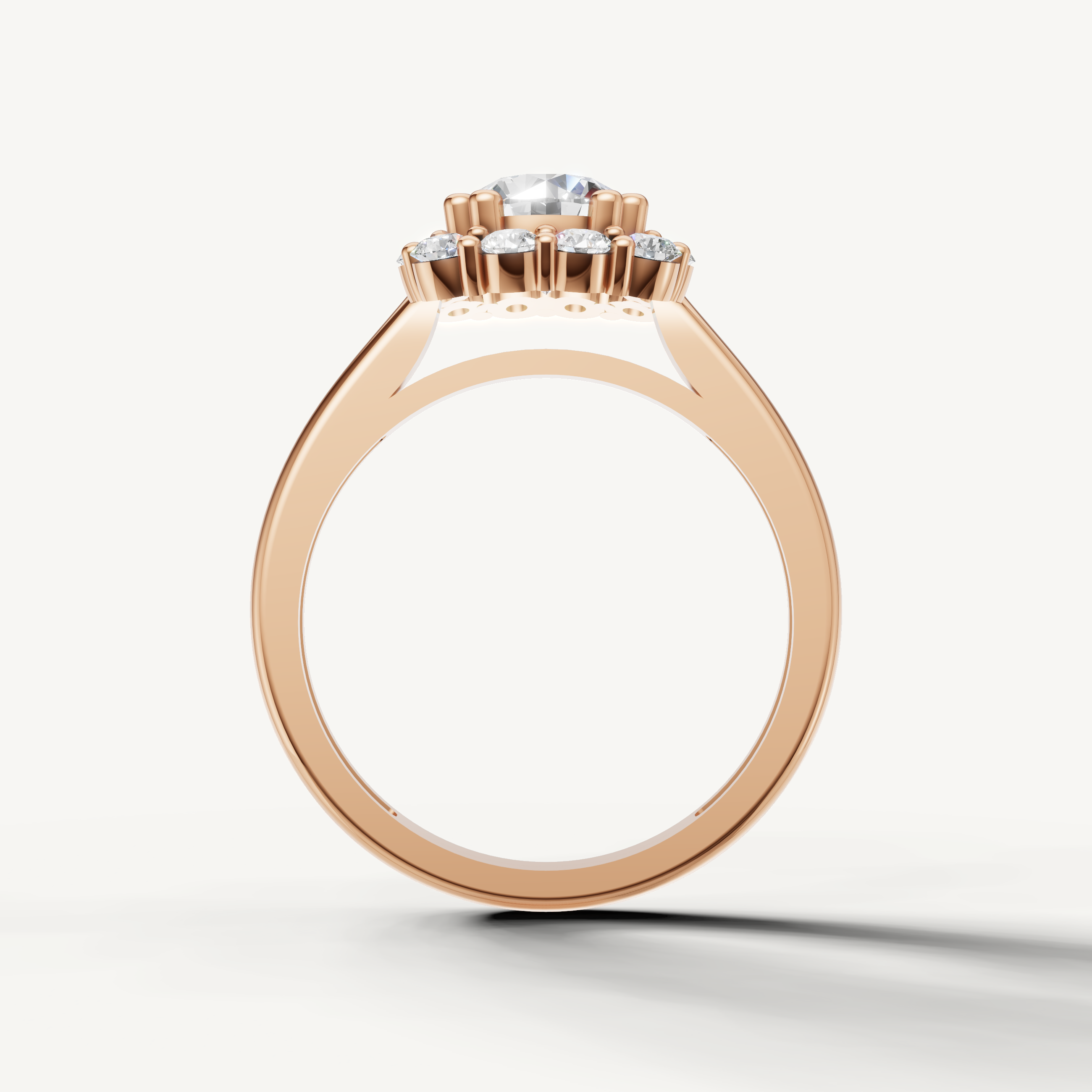 Rose gold round brilliant halo ring with sparkling diamonds by Raul Diamonds.
