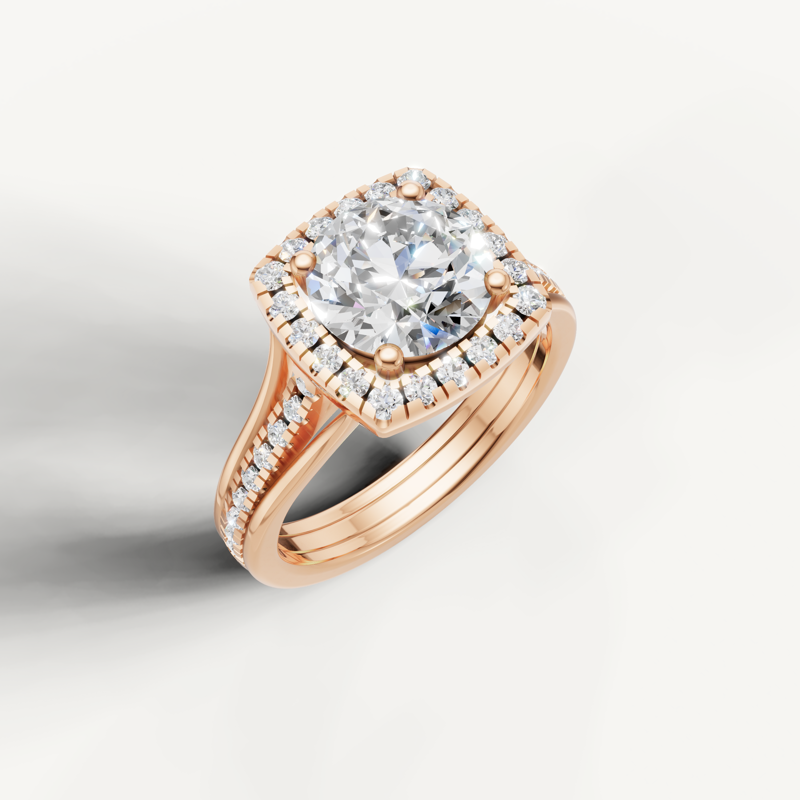 Rose gold round brilliant diamond ring with elegant halo setting by Raul Diamonds.