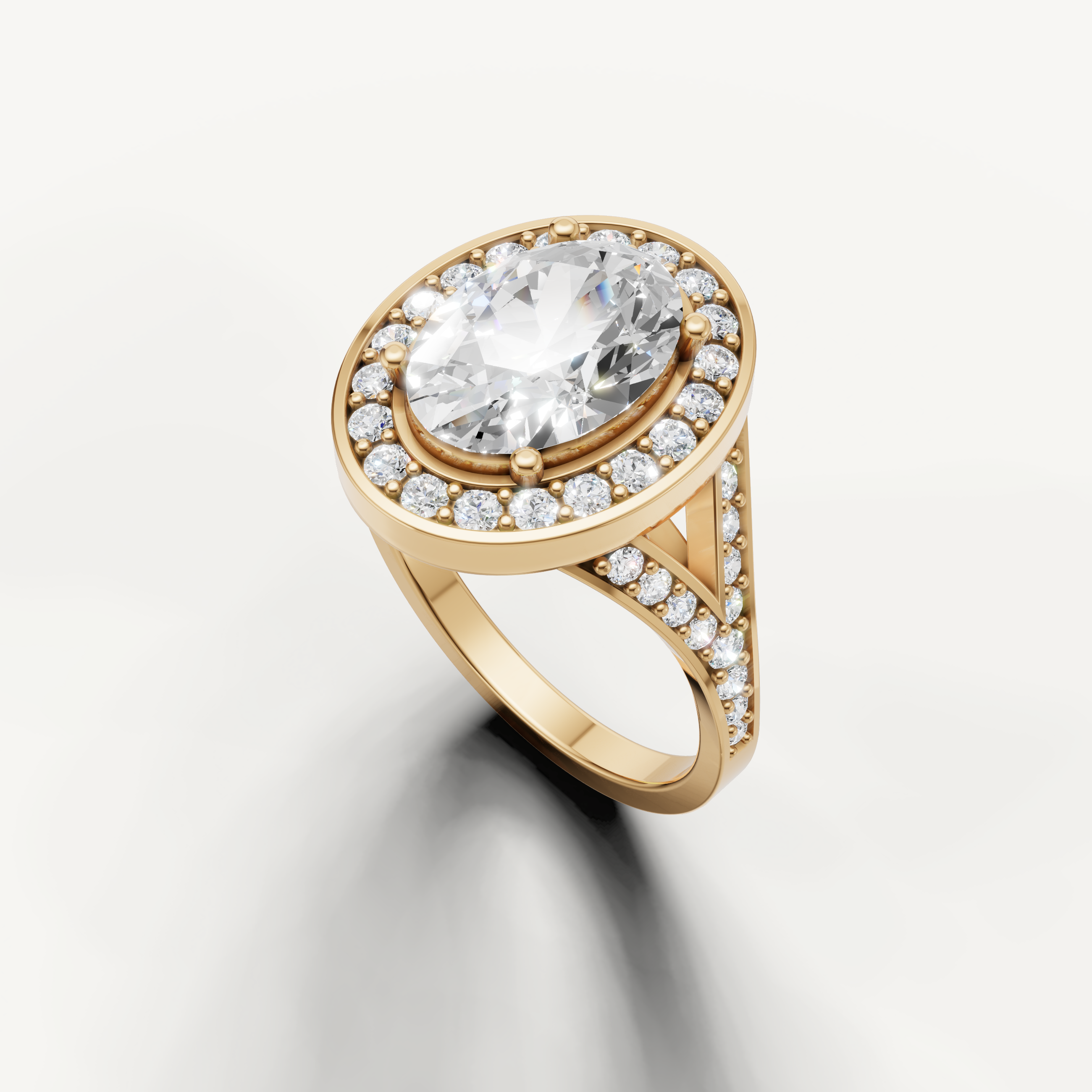 Raul Diamonds oval brilliant engagement ring in yellow gold with split shank design.