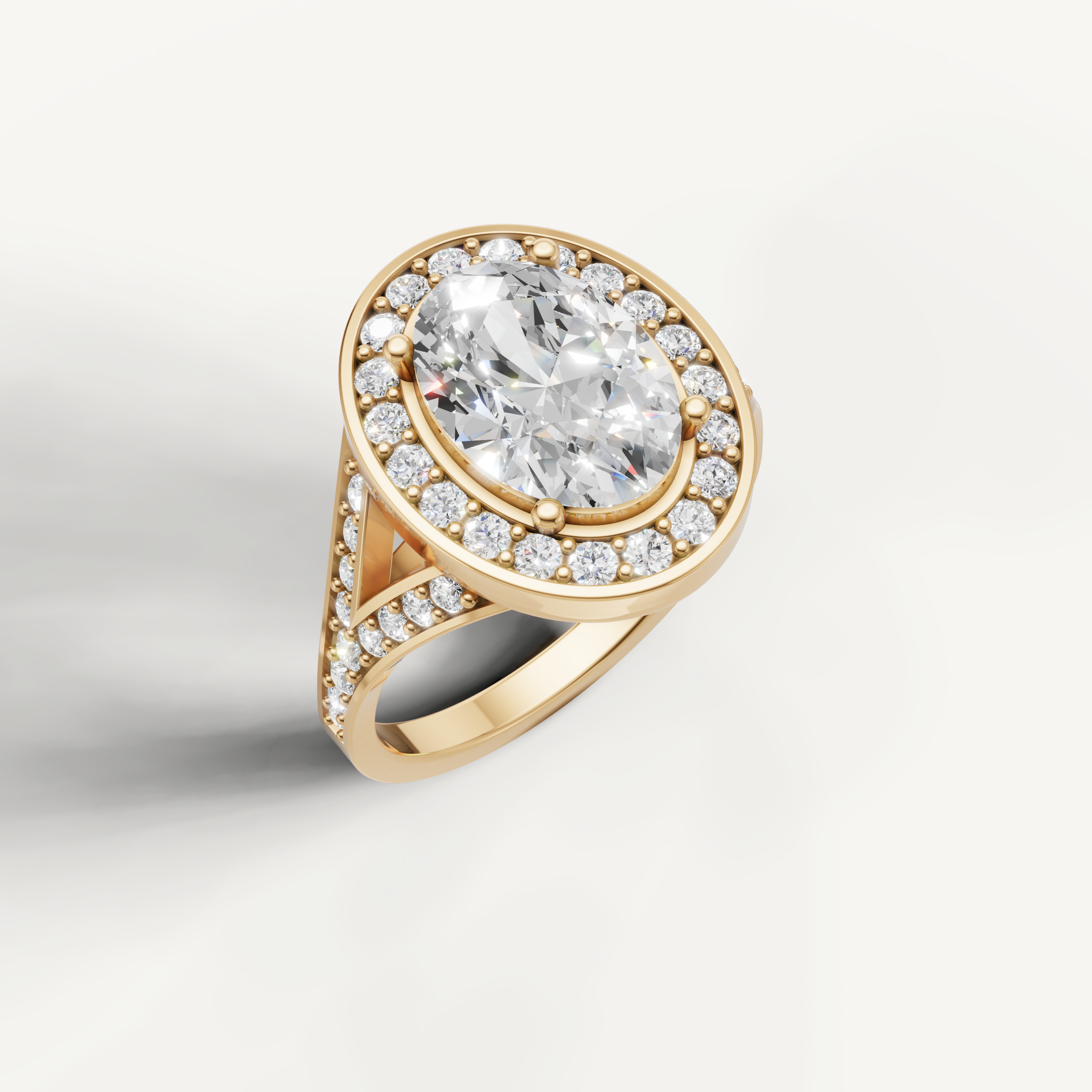 Yellow gold oval cut diamond ring with vintage halo setting by Raul Diamonds.