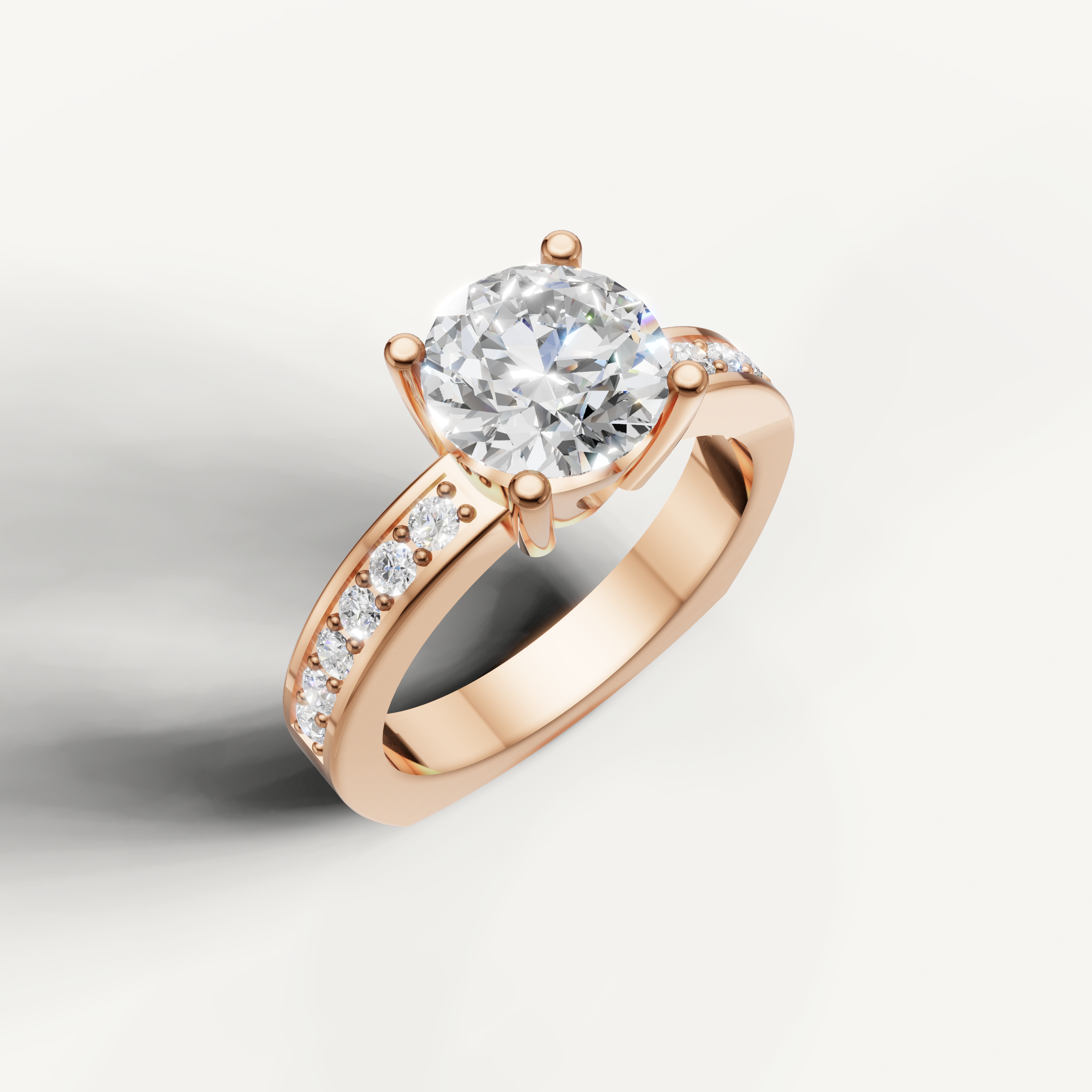 Rose gold round solitaire engagement ring with sparkling side stones