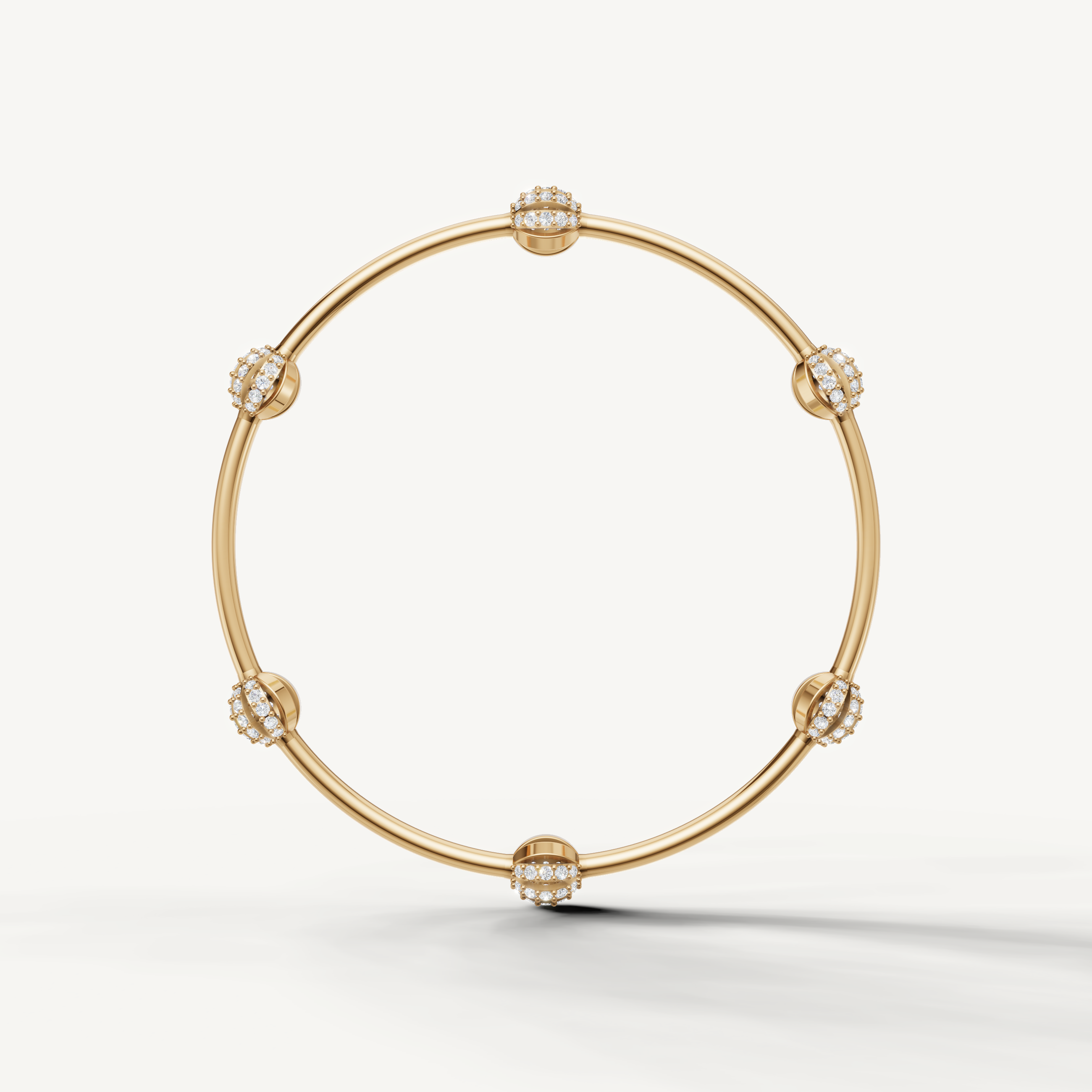 Designer yellow gold bracelet with diamond studded floral spheres and polished finish