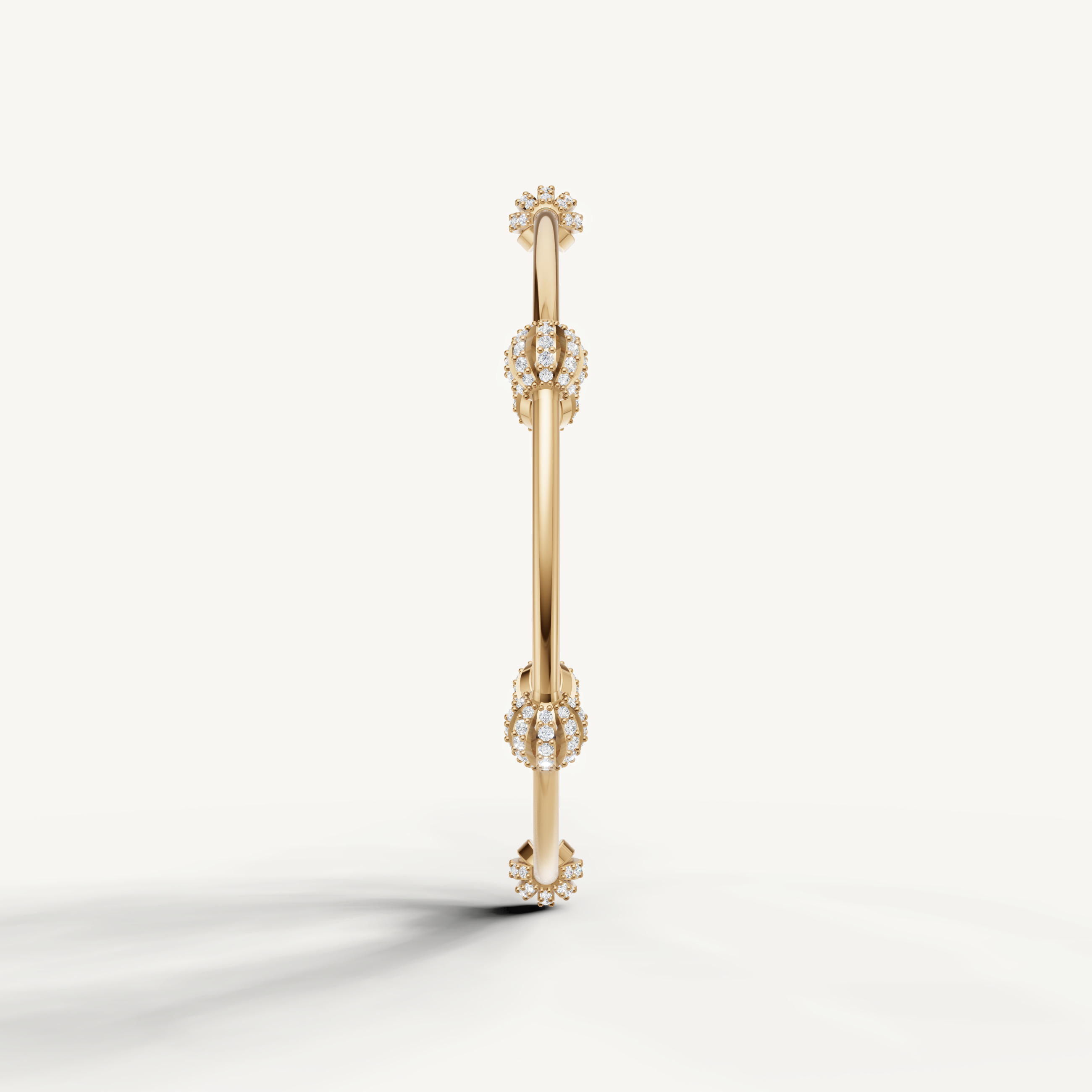 Elegant yellow gold open bangle bracelet featuring round diamond flower motifs