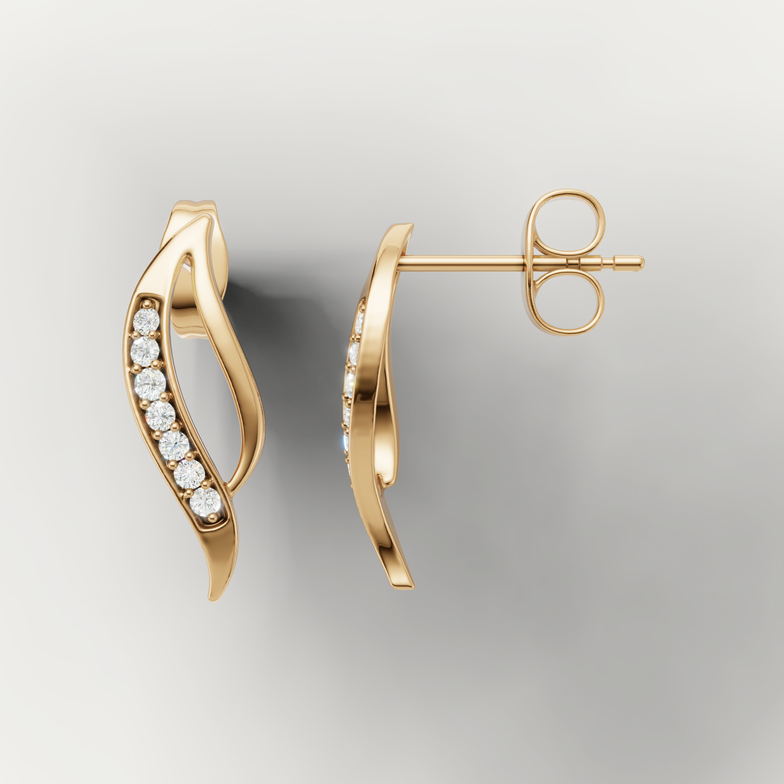 Yellow gold wave style diamond earrings by Raul Diamonds with luxury sparkle