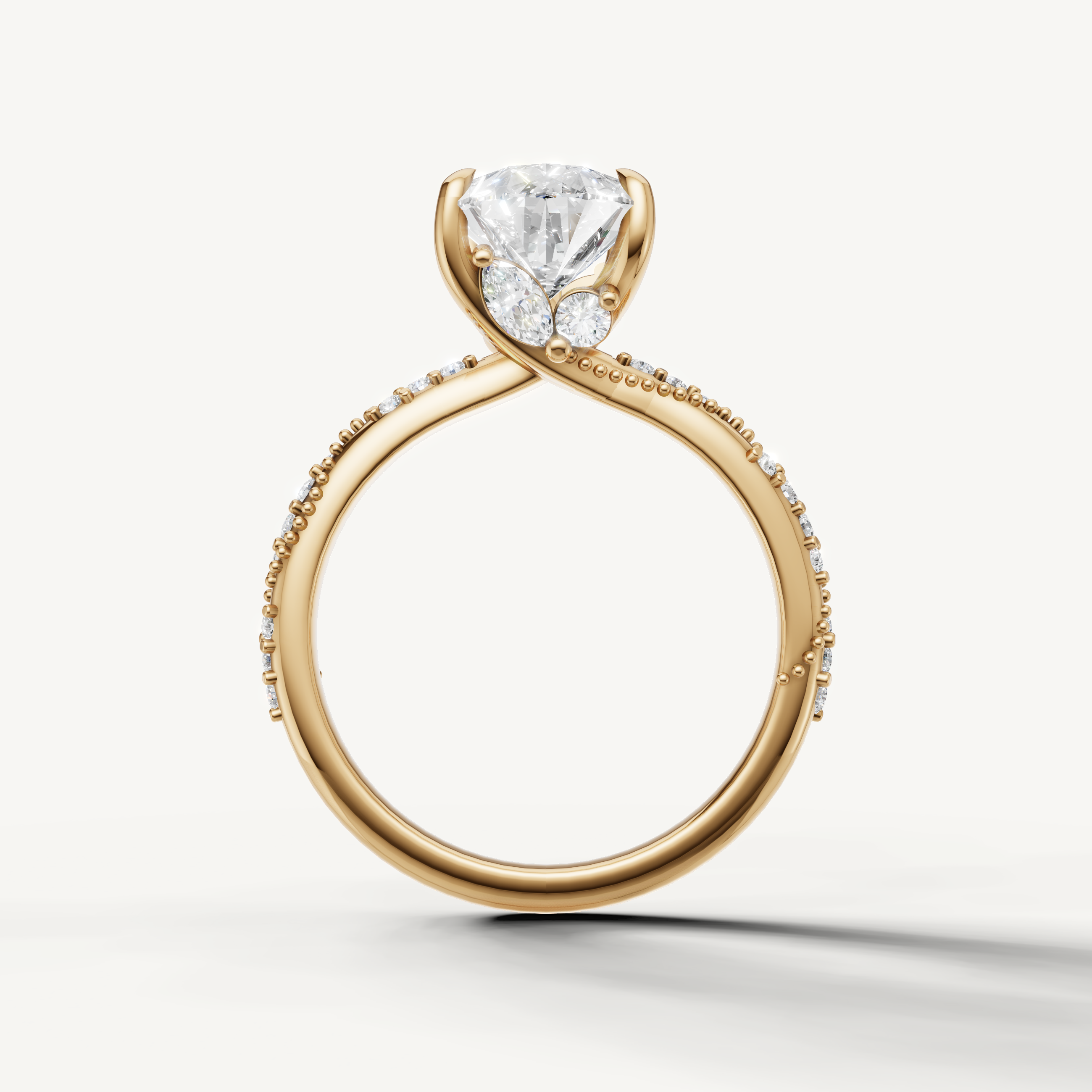 pear diamond engagement ring with elegant crossover pavé band yellow gold