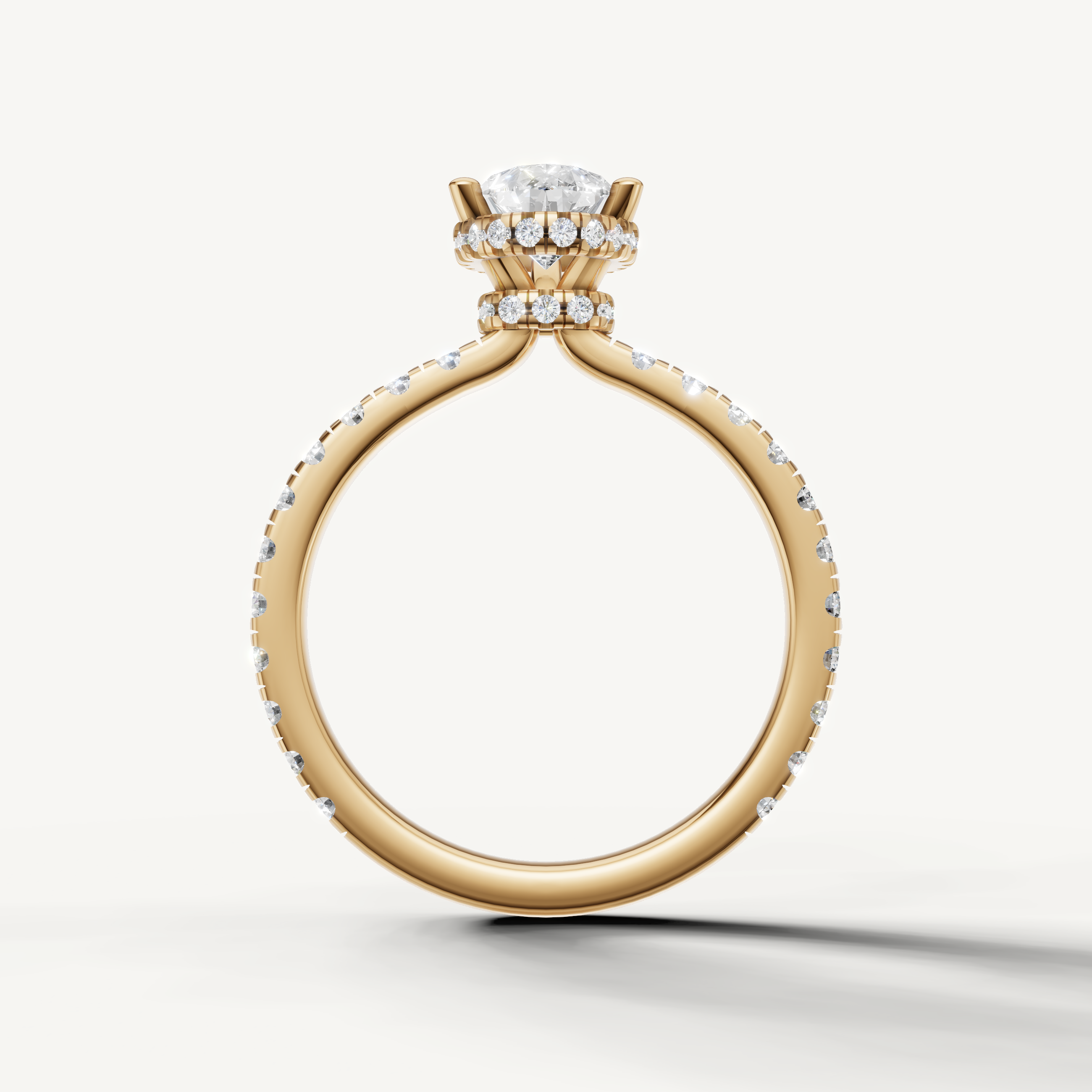 luxurious pear shaped lab grown diamond engagement ring with hidden halo and pavé diamond band in 14k yellow gold