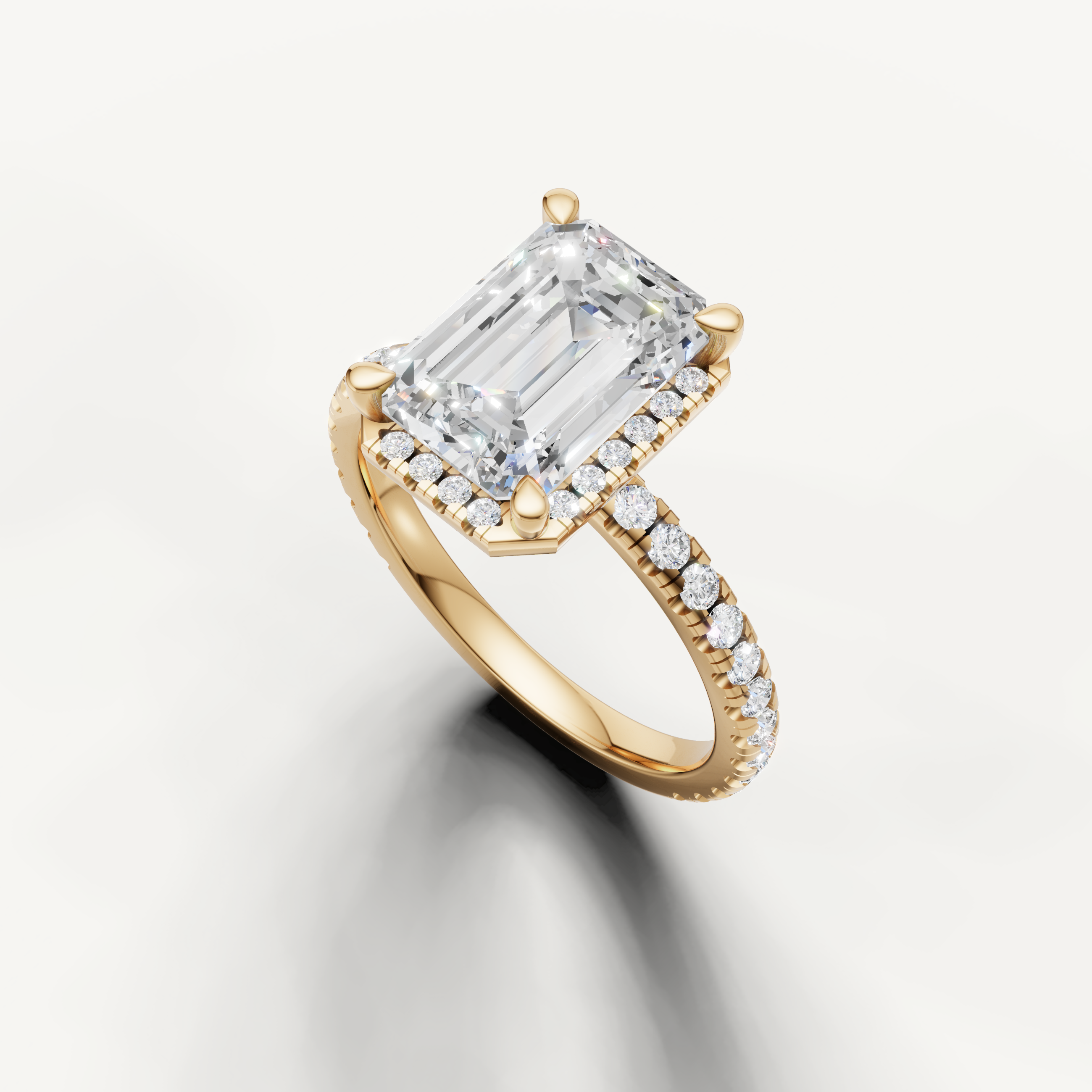 Emerald cut solitaire diamond ring with hidden halo pavé band yellow gold elegant design