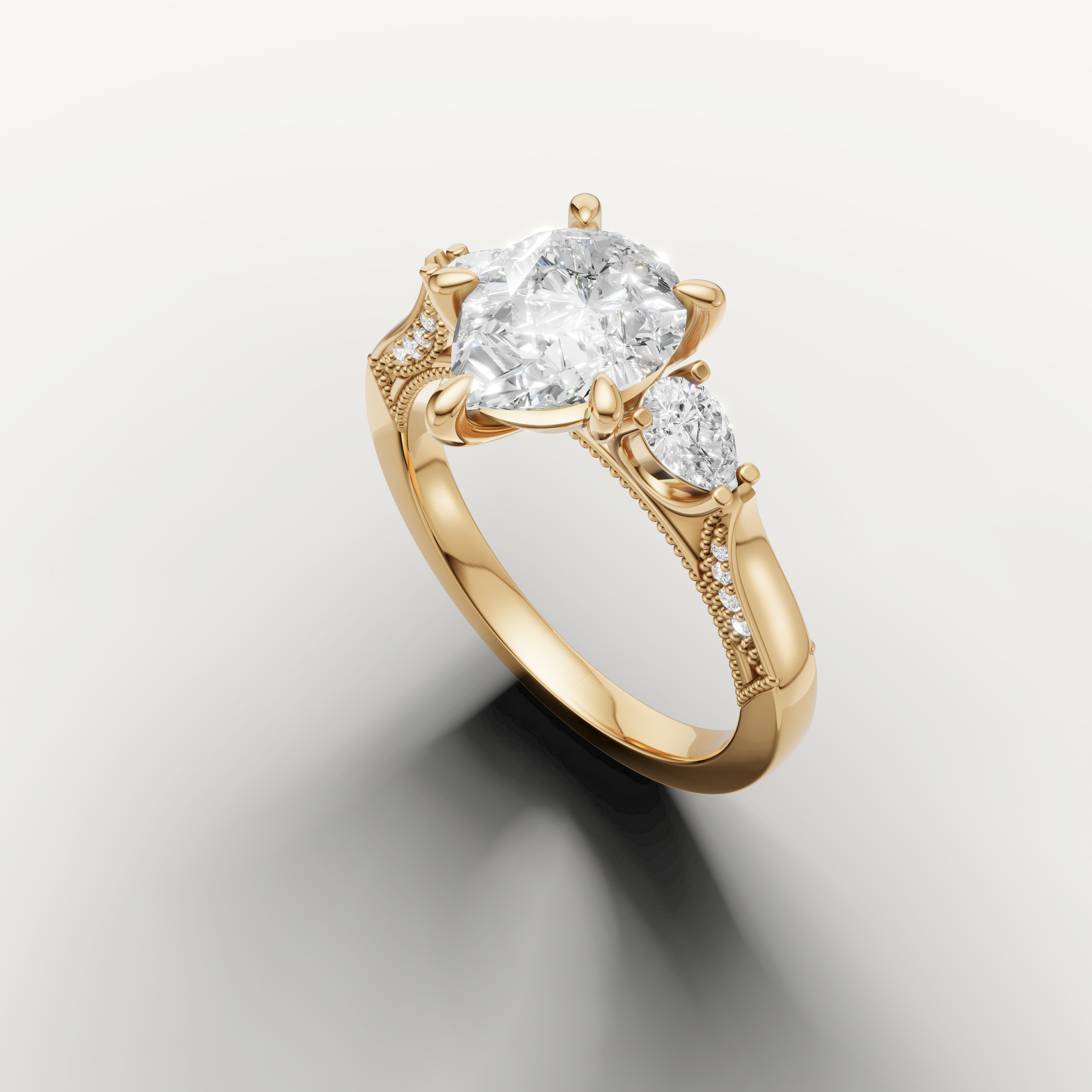 Pear shaped solitaire diamond ring with side pear stones yellow gold elegant design