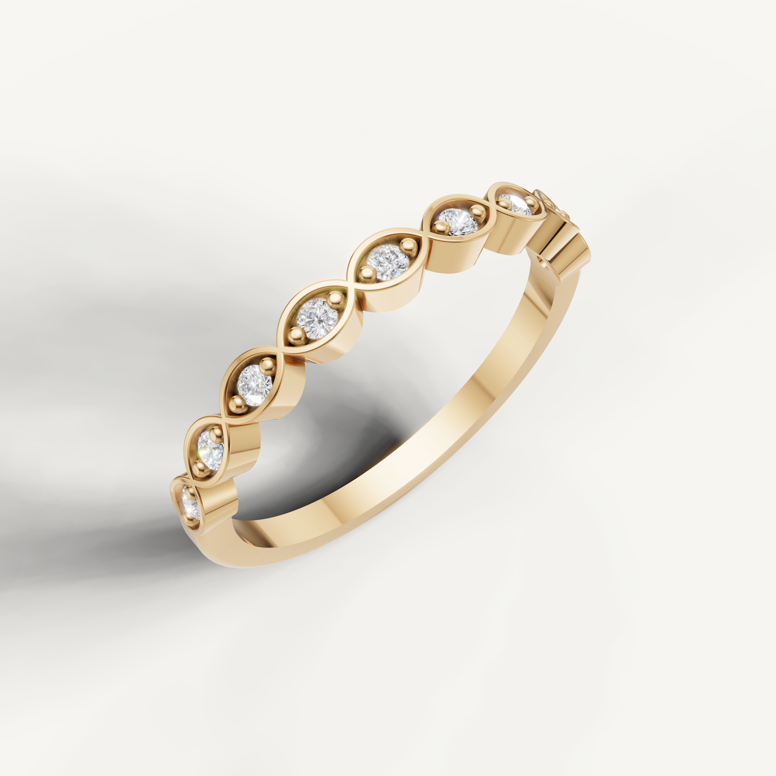 Elegant yellow gold diamond eternity wedding band by Raul Diamonds with bezel style round diamonds