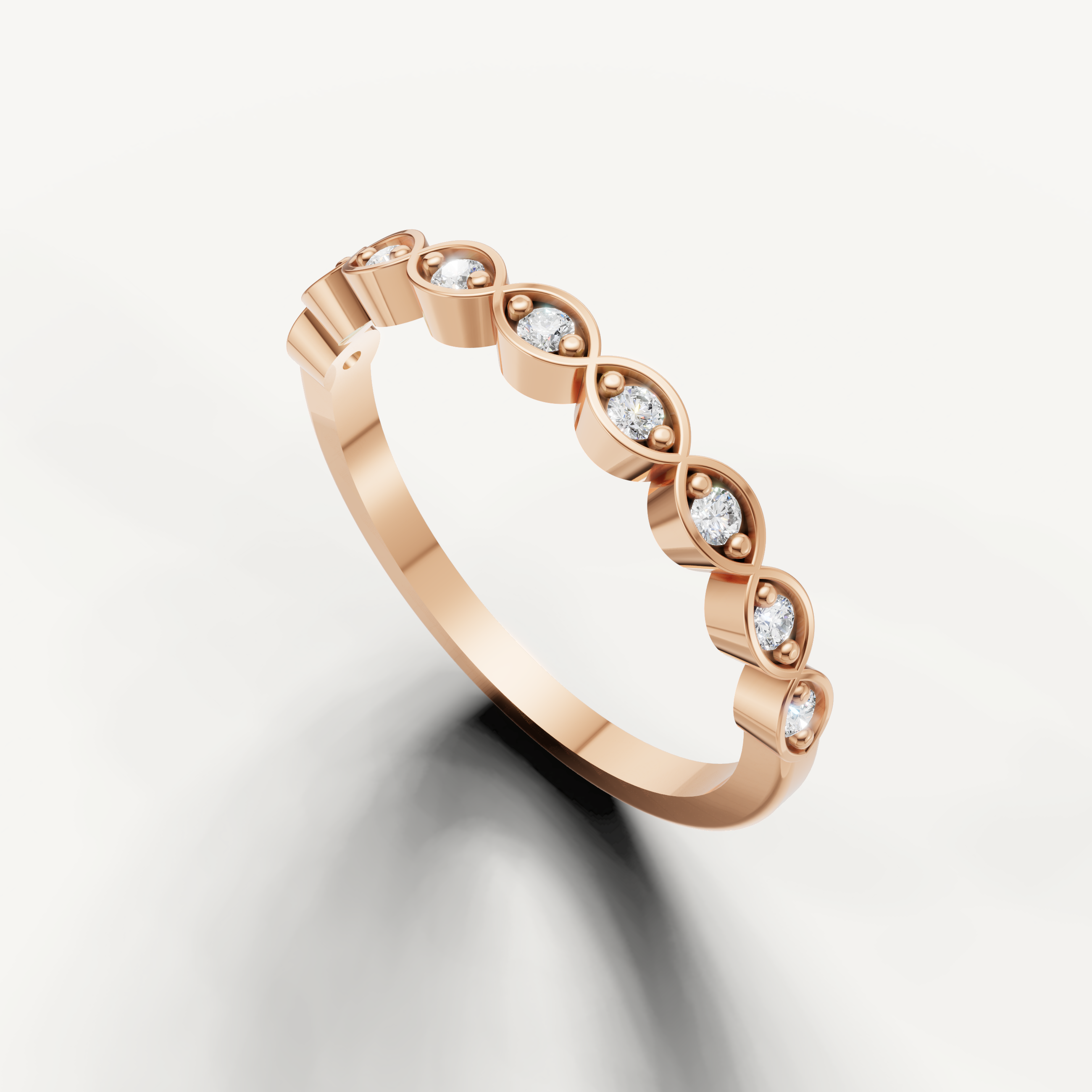 Rose gold stackable wedding band featuring round cut diamonds and elegant infinity pattern
