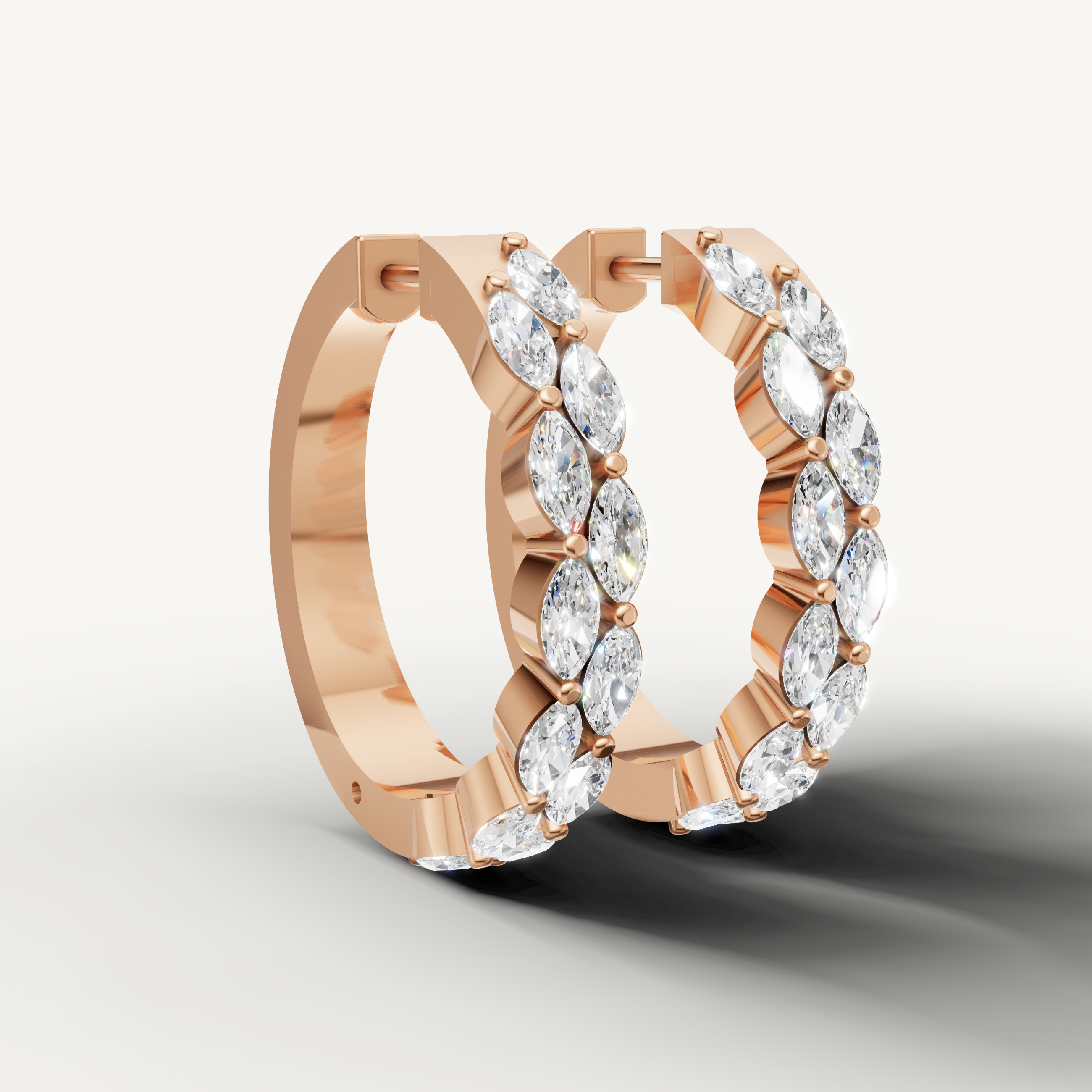 Luxury rose gold diamond hoop earrings with alternating marquise stones by Raul Diamonds
