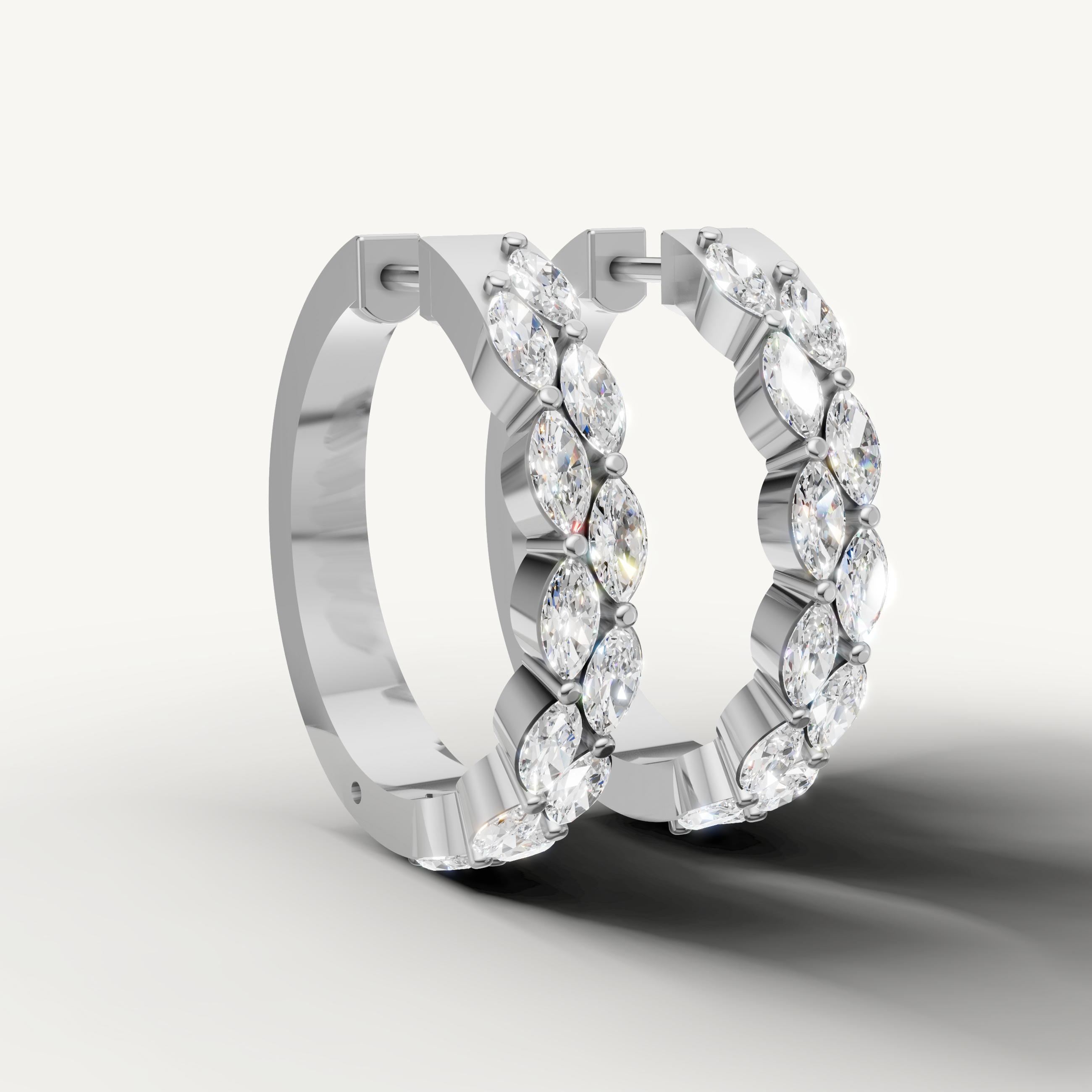 Luxury white gold diamond hoop earrings with alternating marquise diamonds by Raul Diamonds