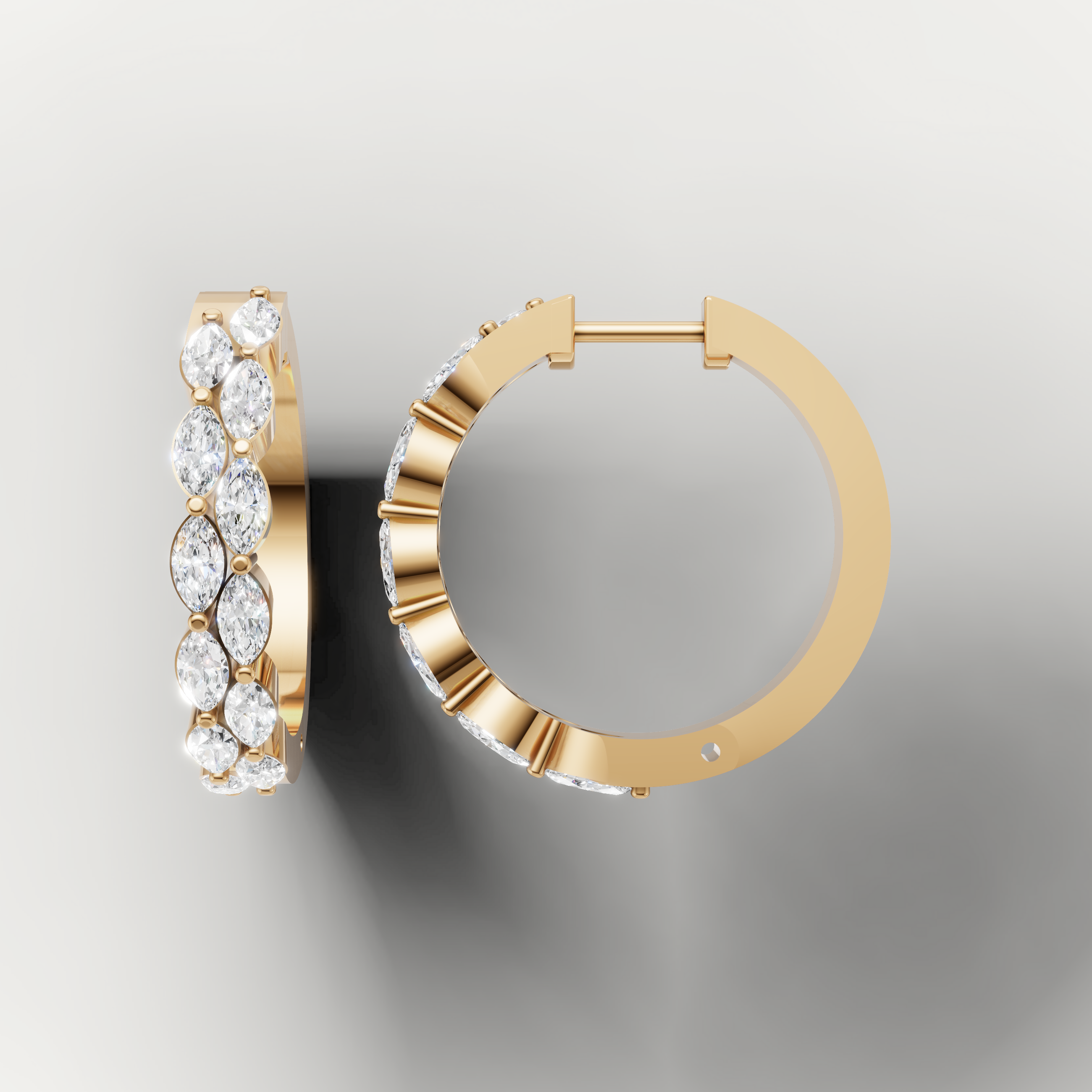 Yellow gold marquise cut diamond hoop earrings by Raul Diamonds featuring elegant modern styling