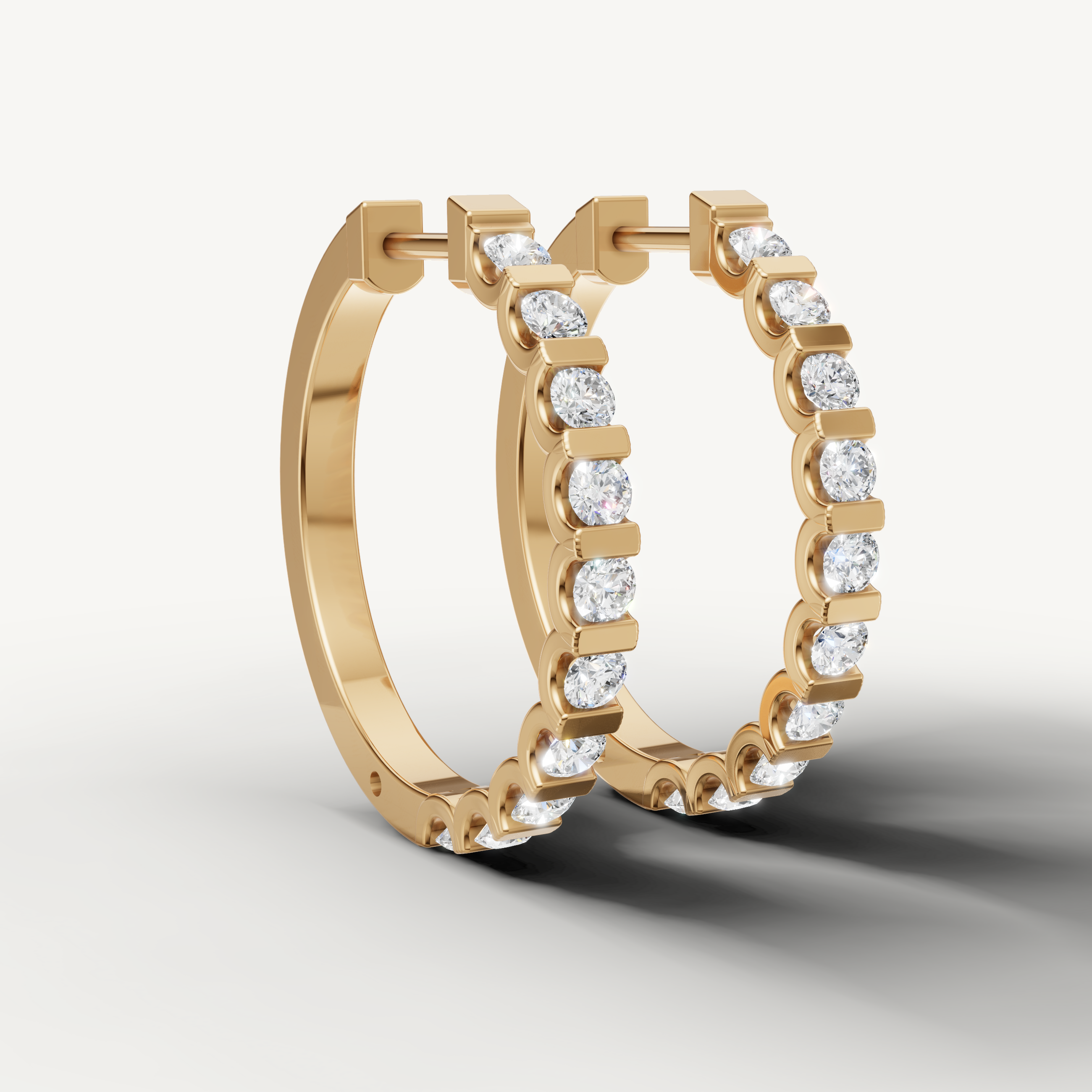 Luxury yellow gold diamond huggie earrings for women with elegant bezel brilliance by Raul Diamonds