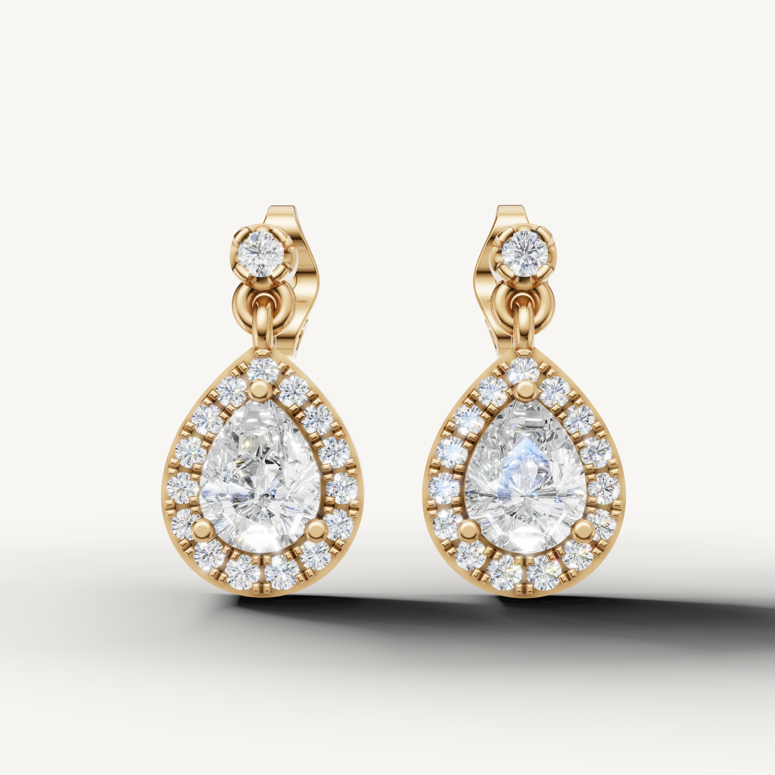 Raul Diamonds yellow gold pear shape halo diamond drop earrings with timeless elegance