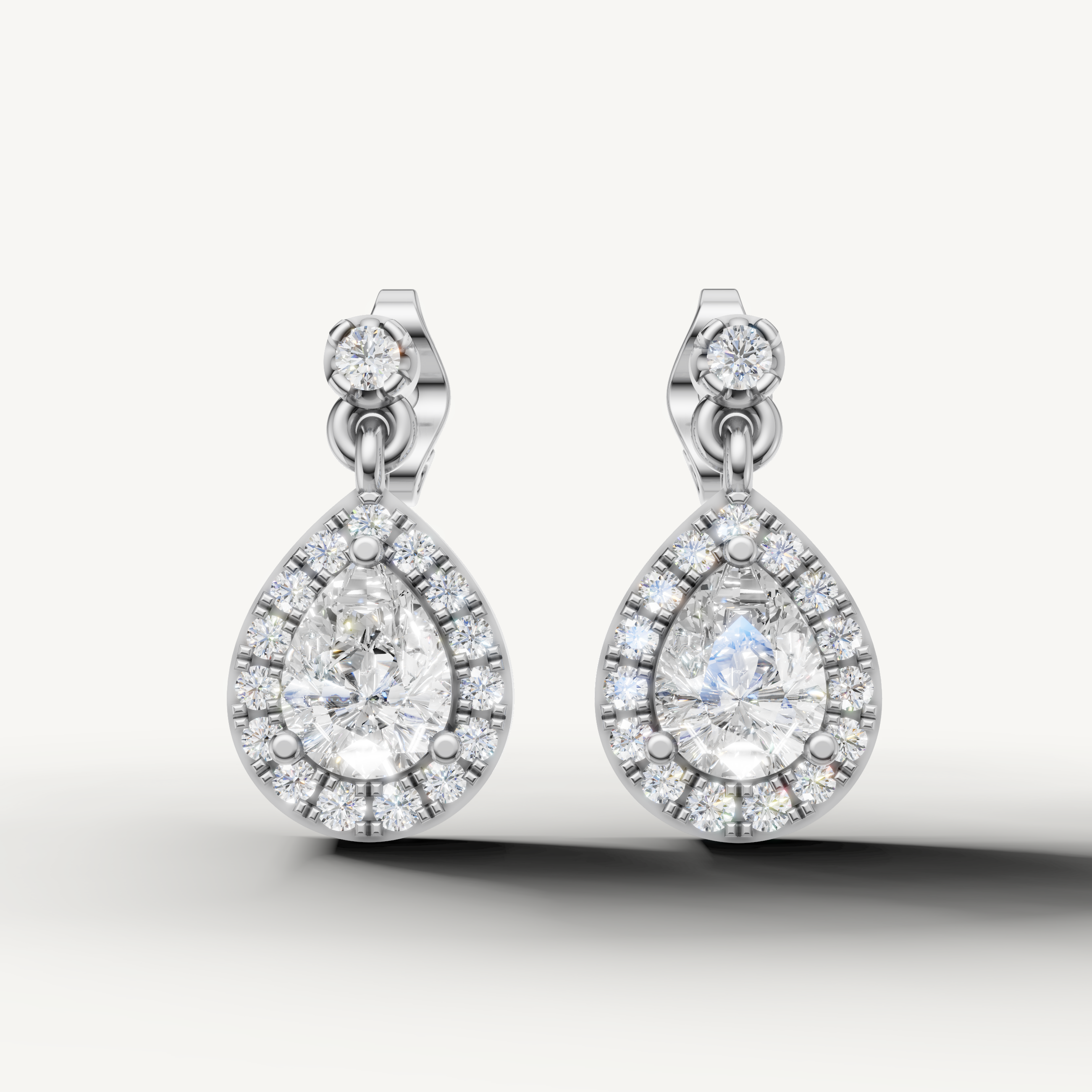 Raul Diamonds white gold pear shape halo diamond drop earrings with radiant brilliance