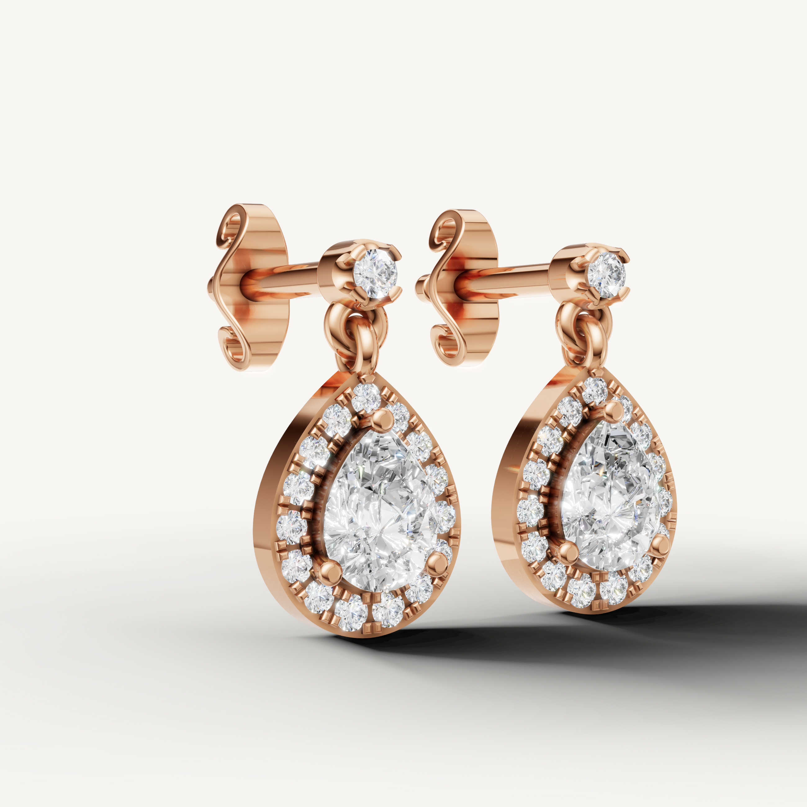 Luxury rose gold teardrop halo diamond earrings with fine jewelry detailing by Raul Diamonds