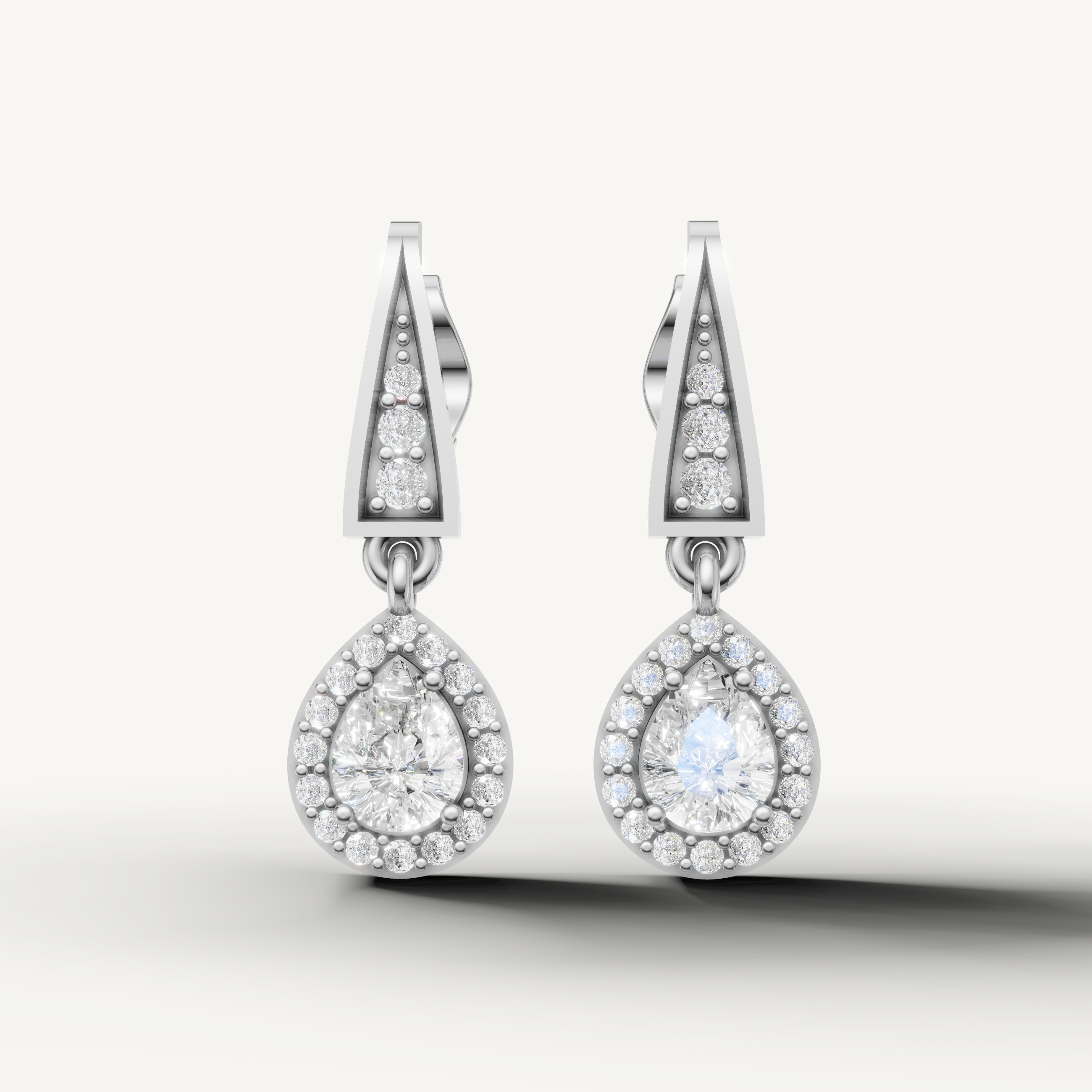 Raul Diamonds white gold pear shape halo diamond drop earrings with brilliant sparkle