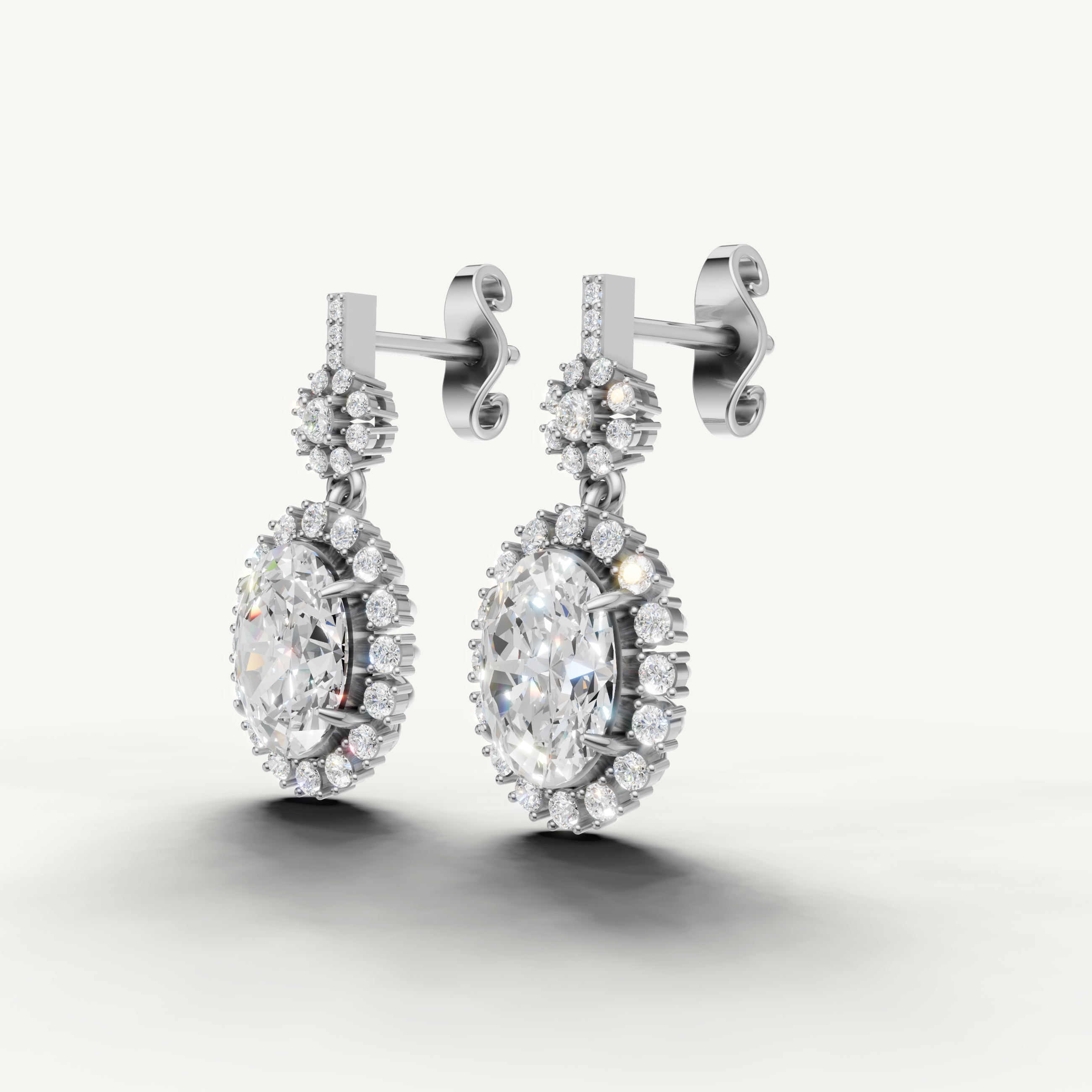 Raul Diamonds white gold oval halo diamond drop earrings with floral inspired detailing