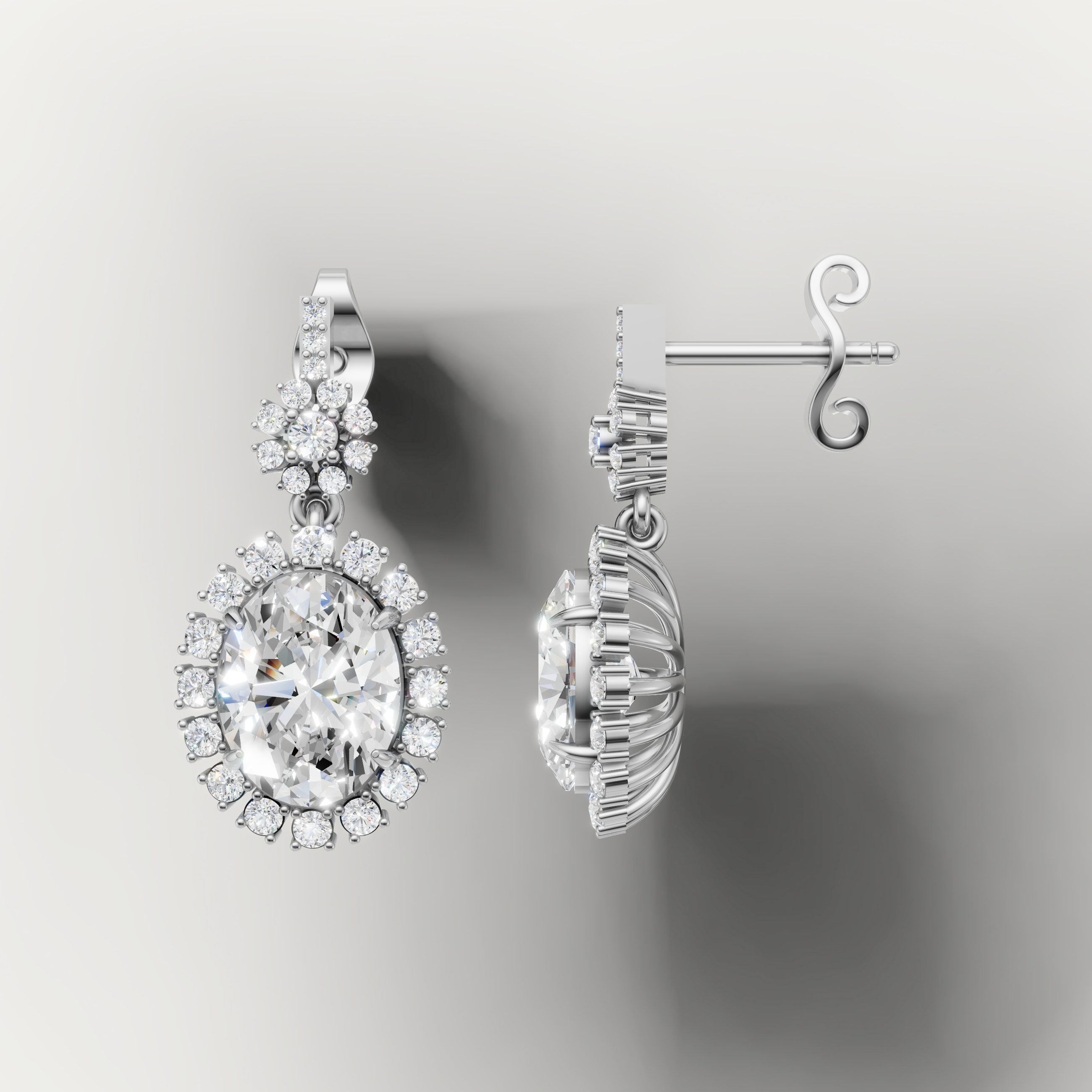 White gold oval cut diamond dangle earrings by Raul Diamonds with timeless sparkle
