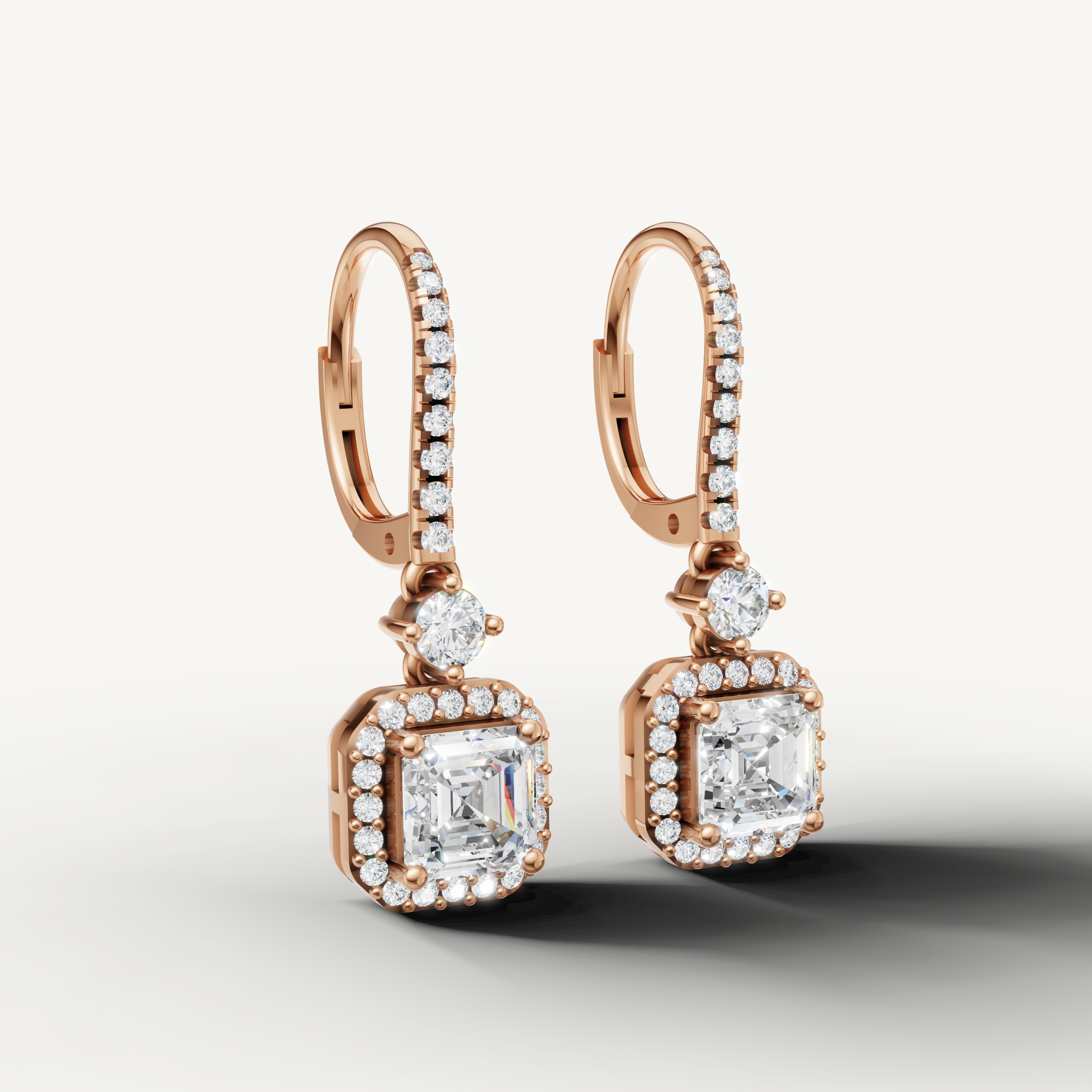 Luxury rose gold halo asscher cut diamond earrings with fine craftsmanship by Raul Diamonds