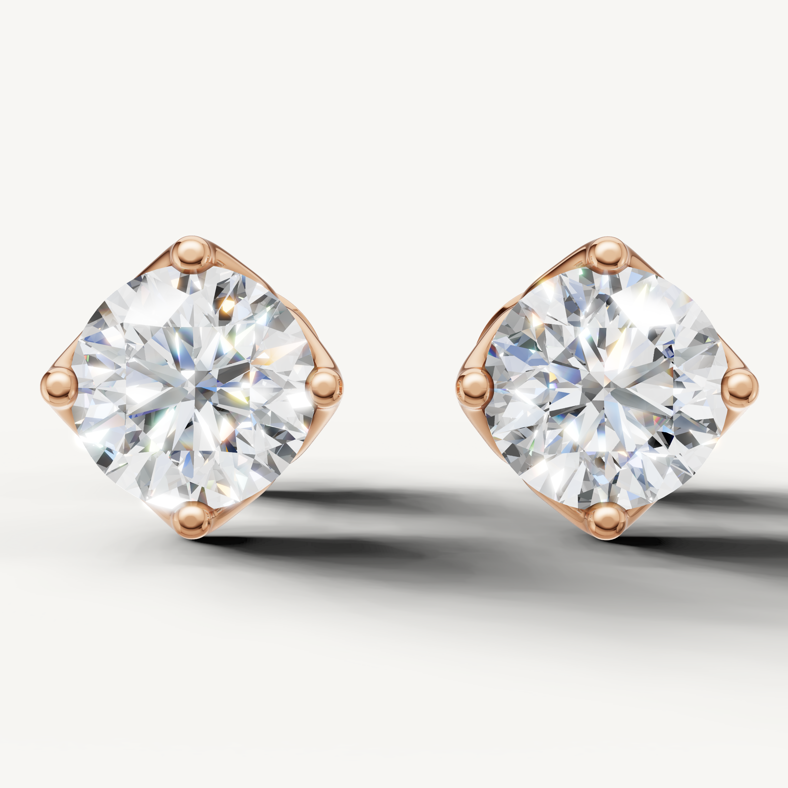 Round lab grown diamond stud earrings in 14K rose gold by Raul Diamonds