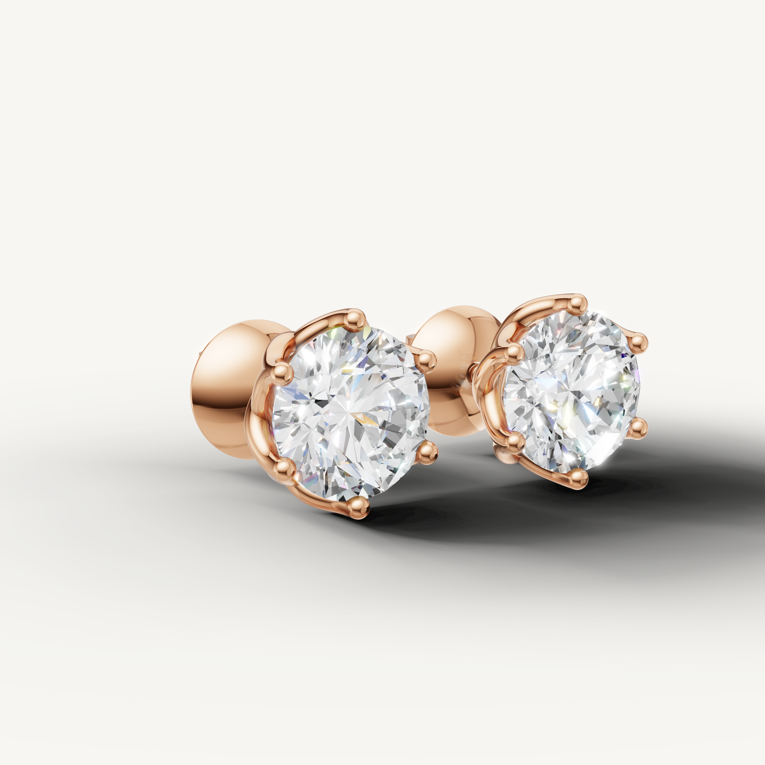 Luxury rose gold solitaire diamond stud earrings with modern elegance by Raul Diamonds