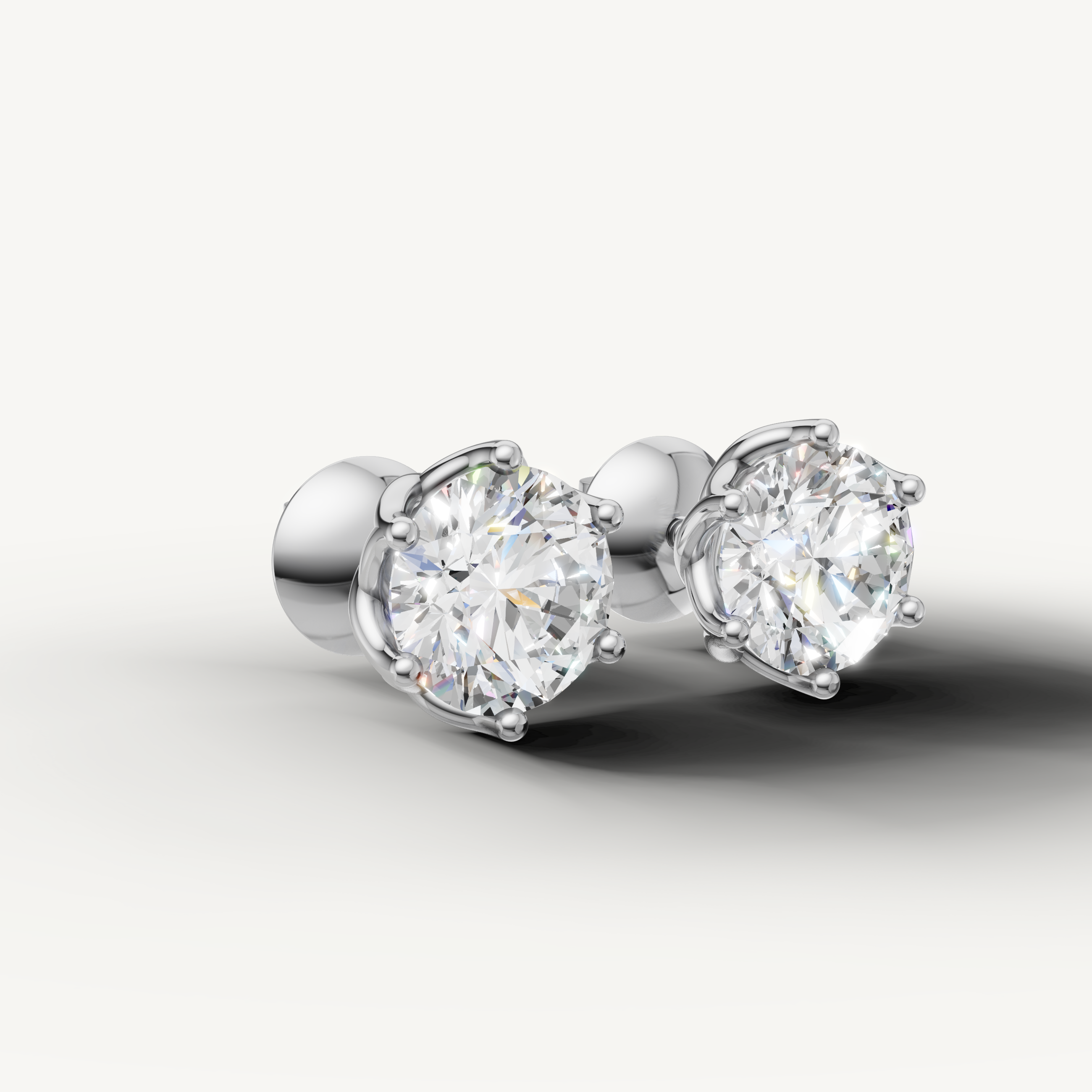 Luxury white gold round cut diamond earrings with timeless craftsmanship by Raul Diamonds