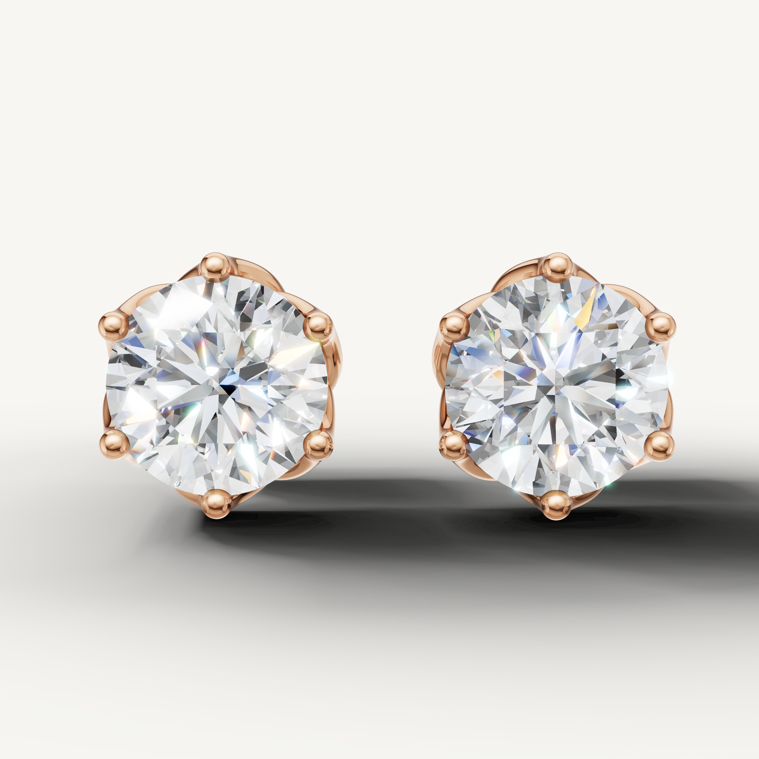 Round lab grown diamond stud earrings in 14K rose gold by Raul Diamonds