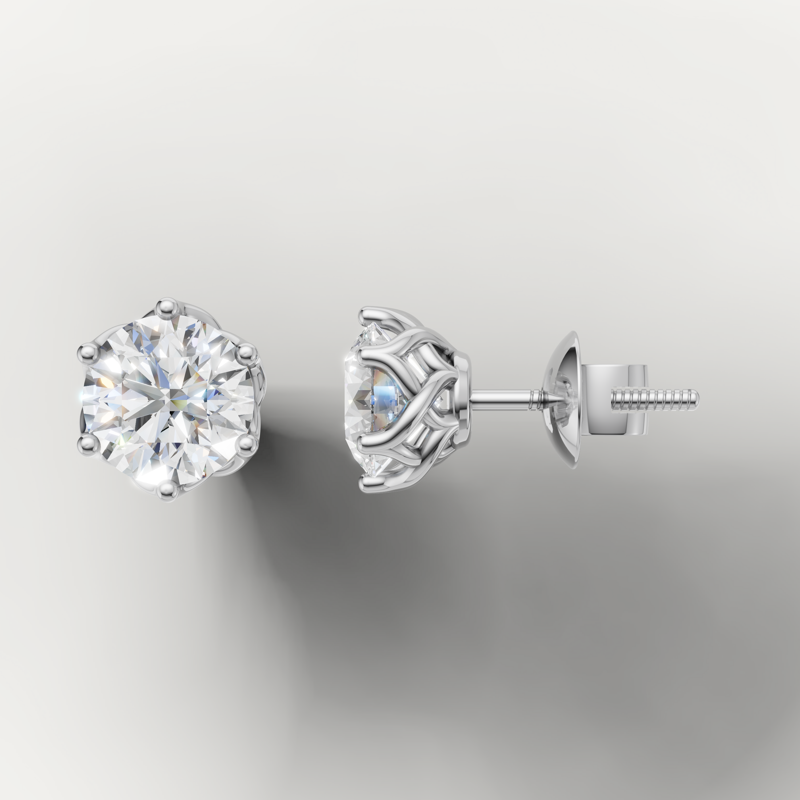 White gold classic diamond stud earrings by Raul Diamonds with six prong setting