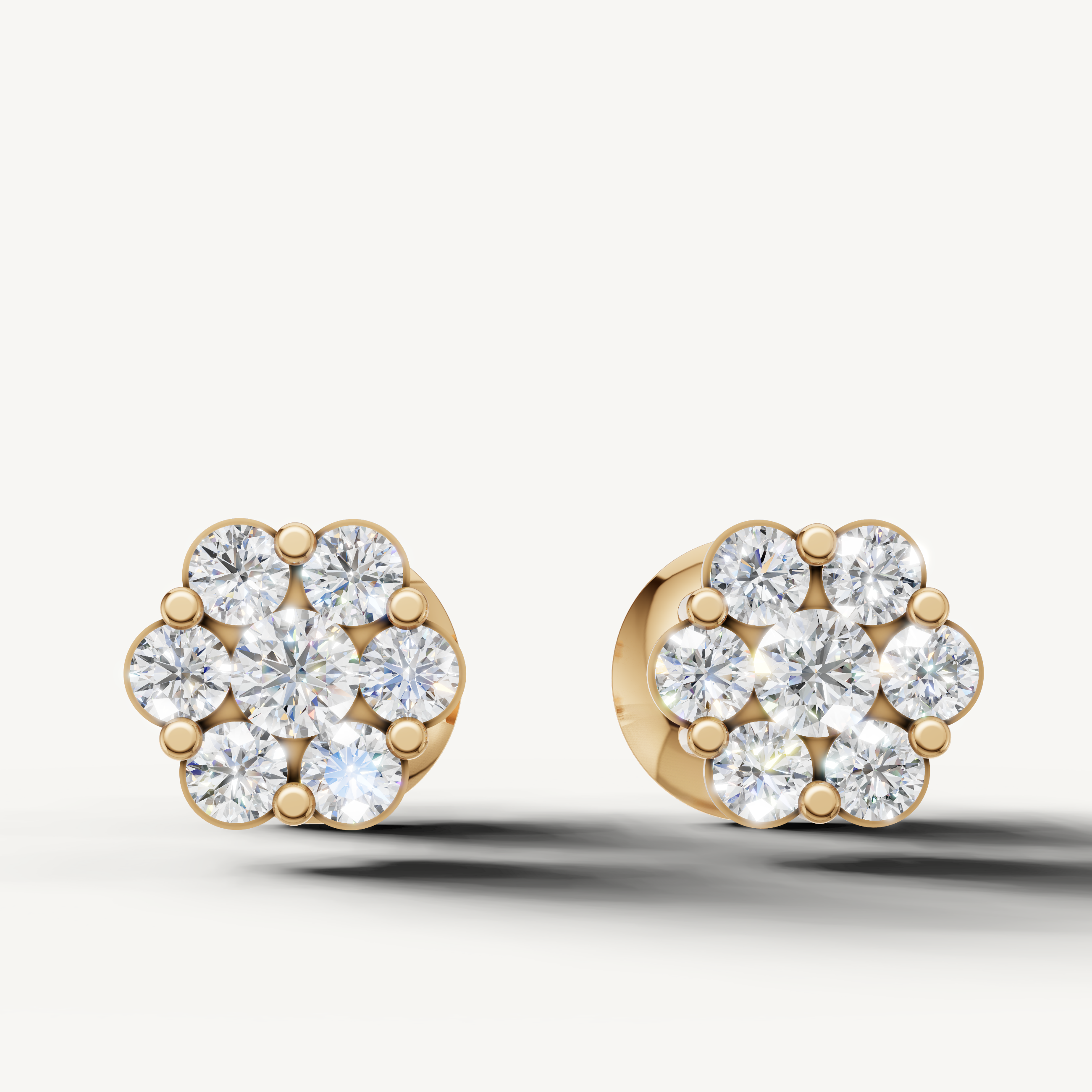 Floral cluster diamond stud earrings in 14K yellow gold by Raul Diamonds