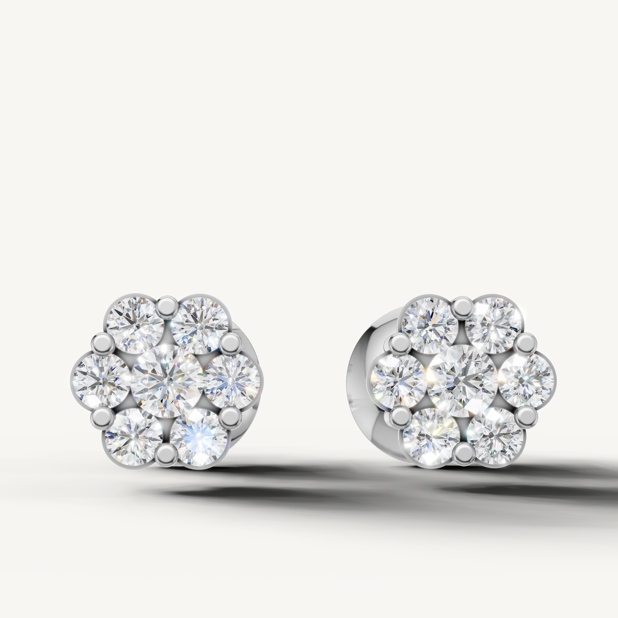Floral cluster diamond stud earrings in 14K white gold by Raul Diamonds