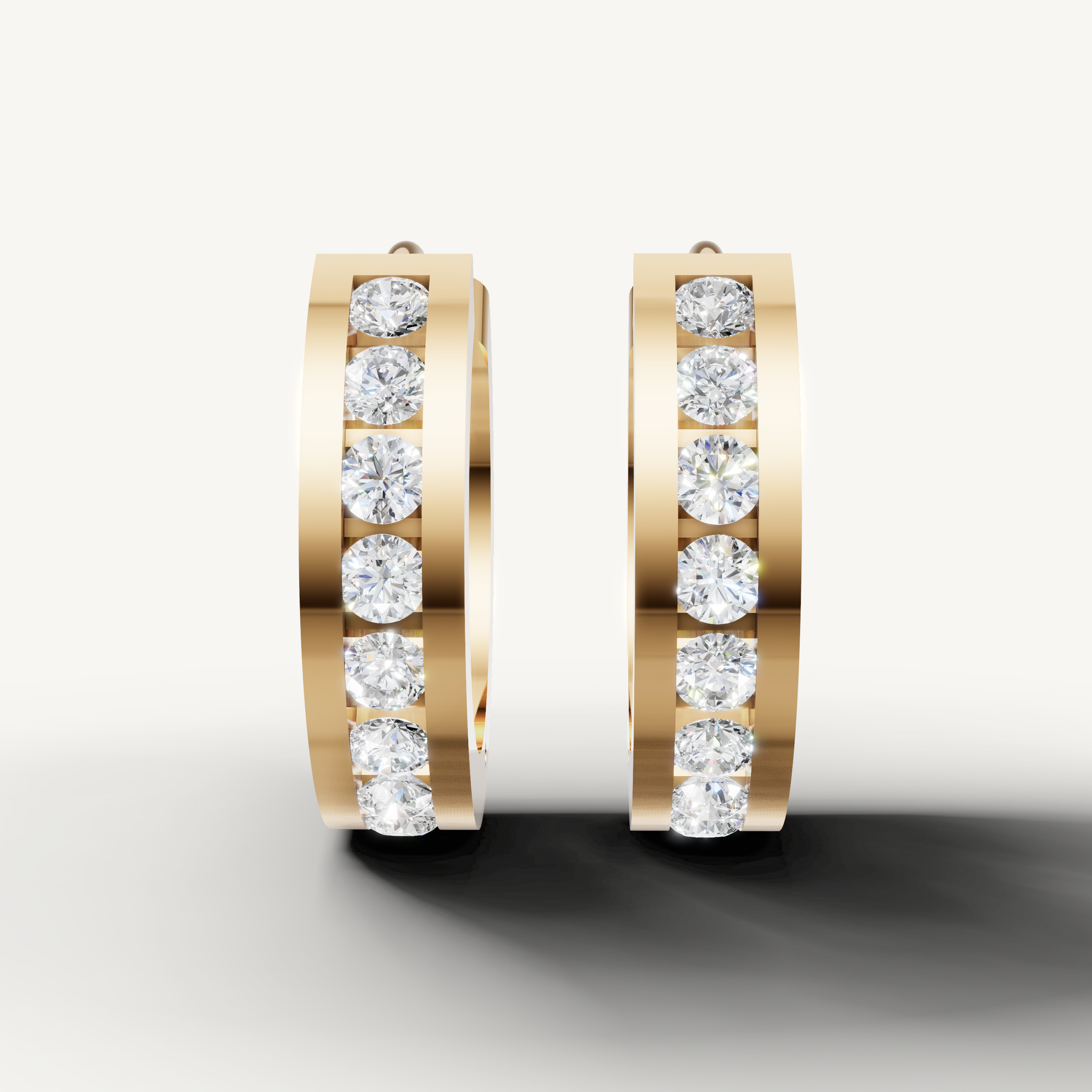Raul Diamonds yellow gold diamond hoop earrings with round brilliant diamonds and sleek modern design