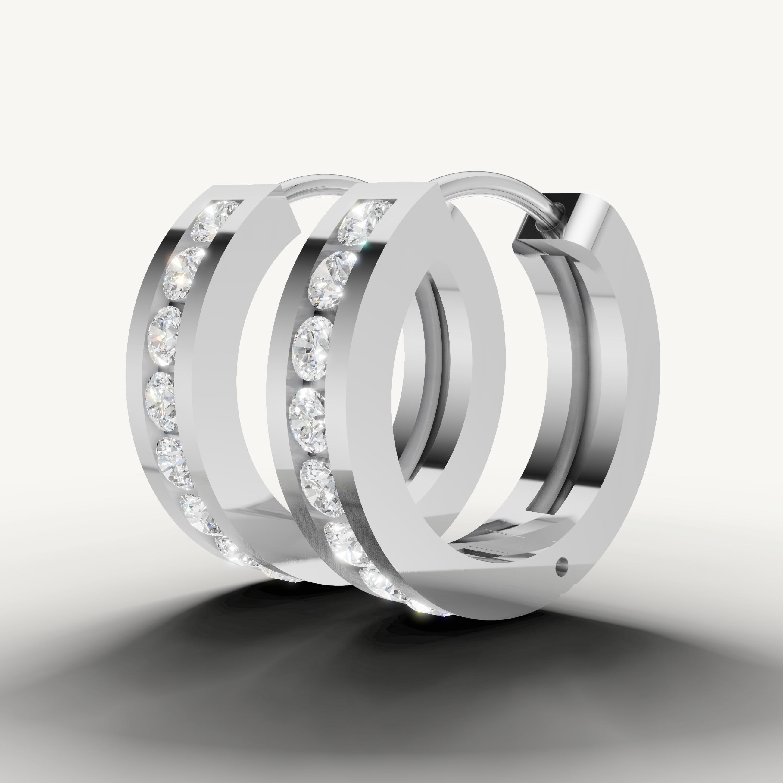 Raul Diamonds white gold diamond earrings with contemporary hoop silhouette and radiant diamond shine