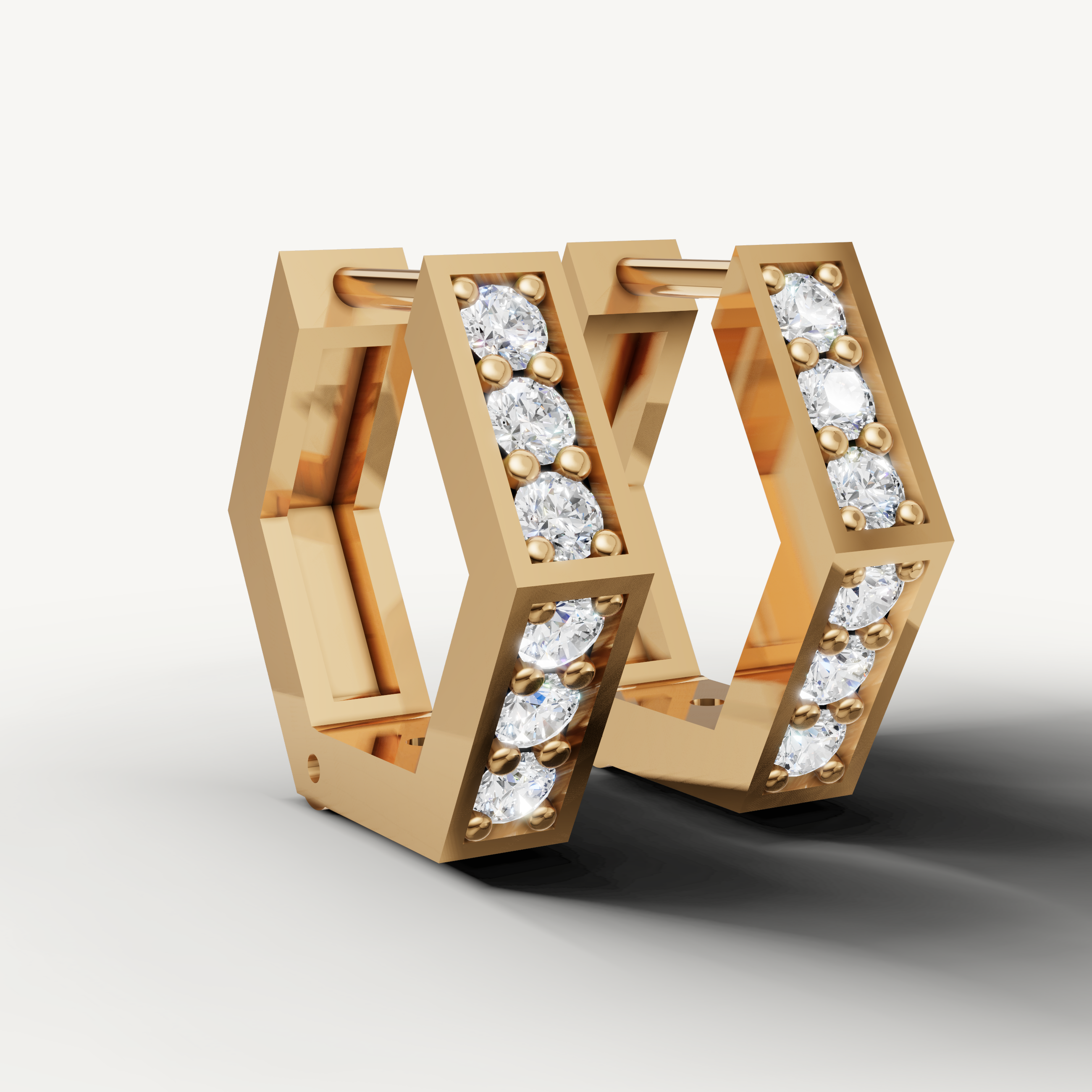 Yellow gold diamond earrings for women with sleek geometric hoop styling by Raul Diamonds fine jewelry