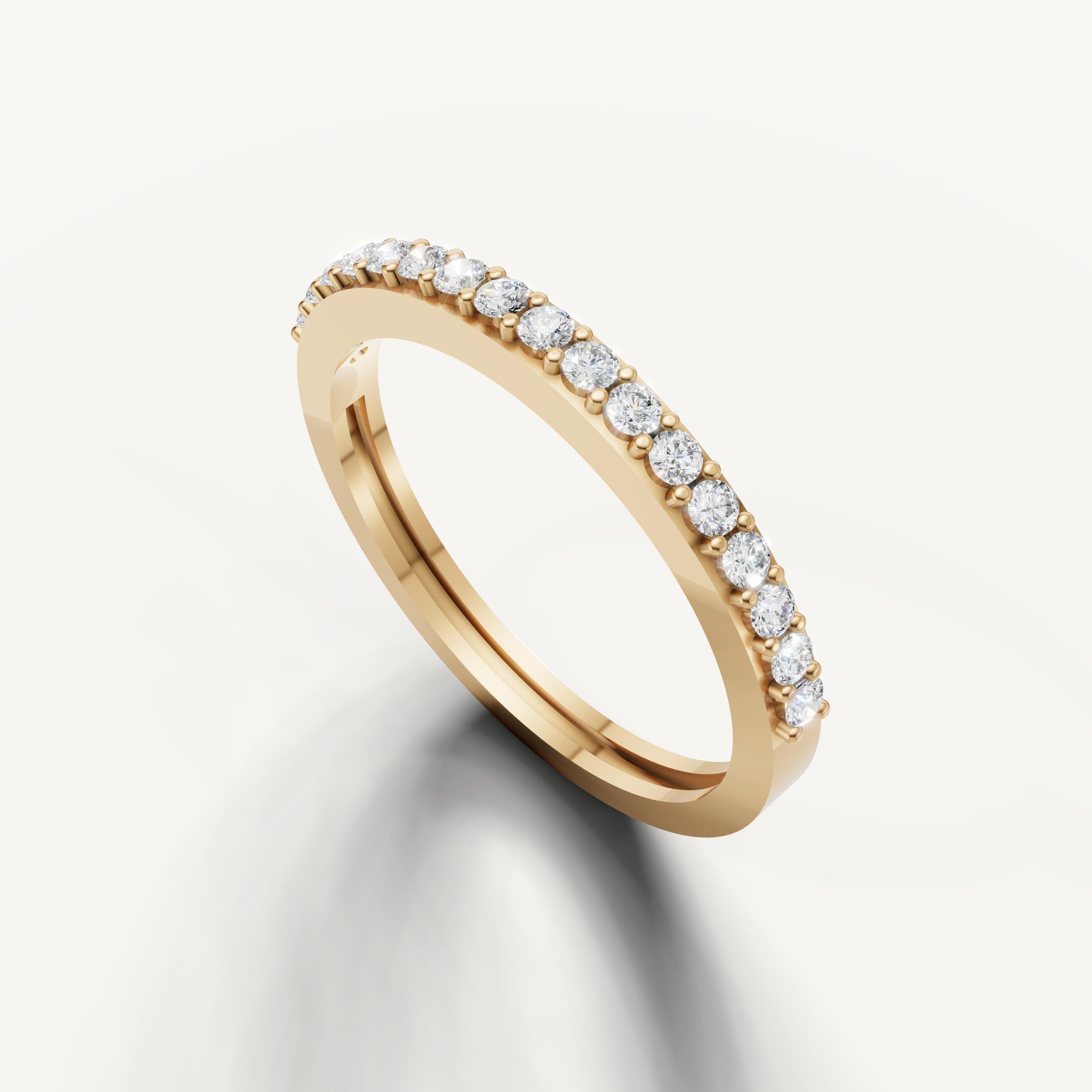 Yellow gold minimalist eternity wedding ring featuring round diamonds and classic prong setting