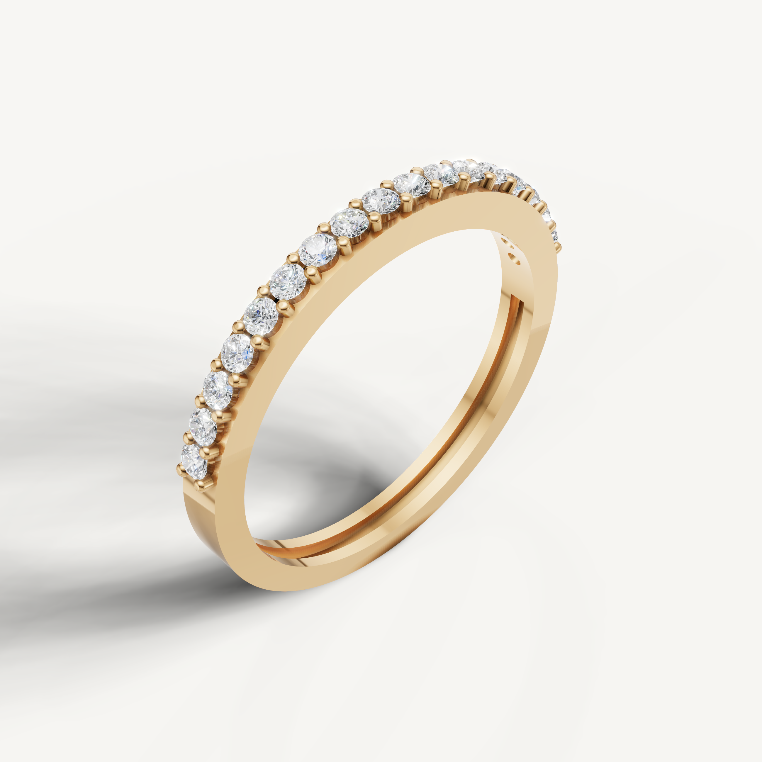 Elegant yellow gold pavé diamond wedding band by Raul Diamonds with sparkling round cut diamonds
