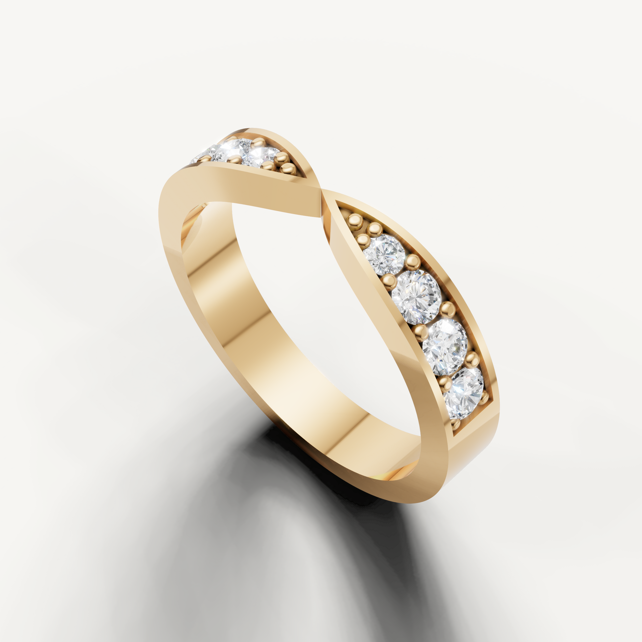 Yellow gold infinity style wedding band featuring channel set round diamonds and modern elegance