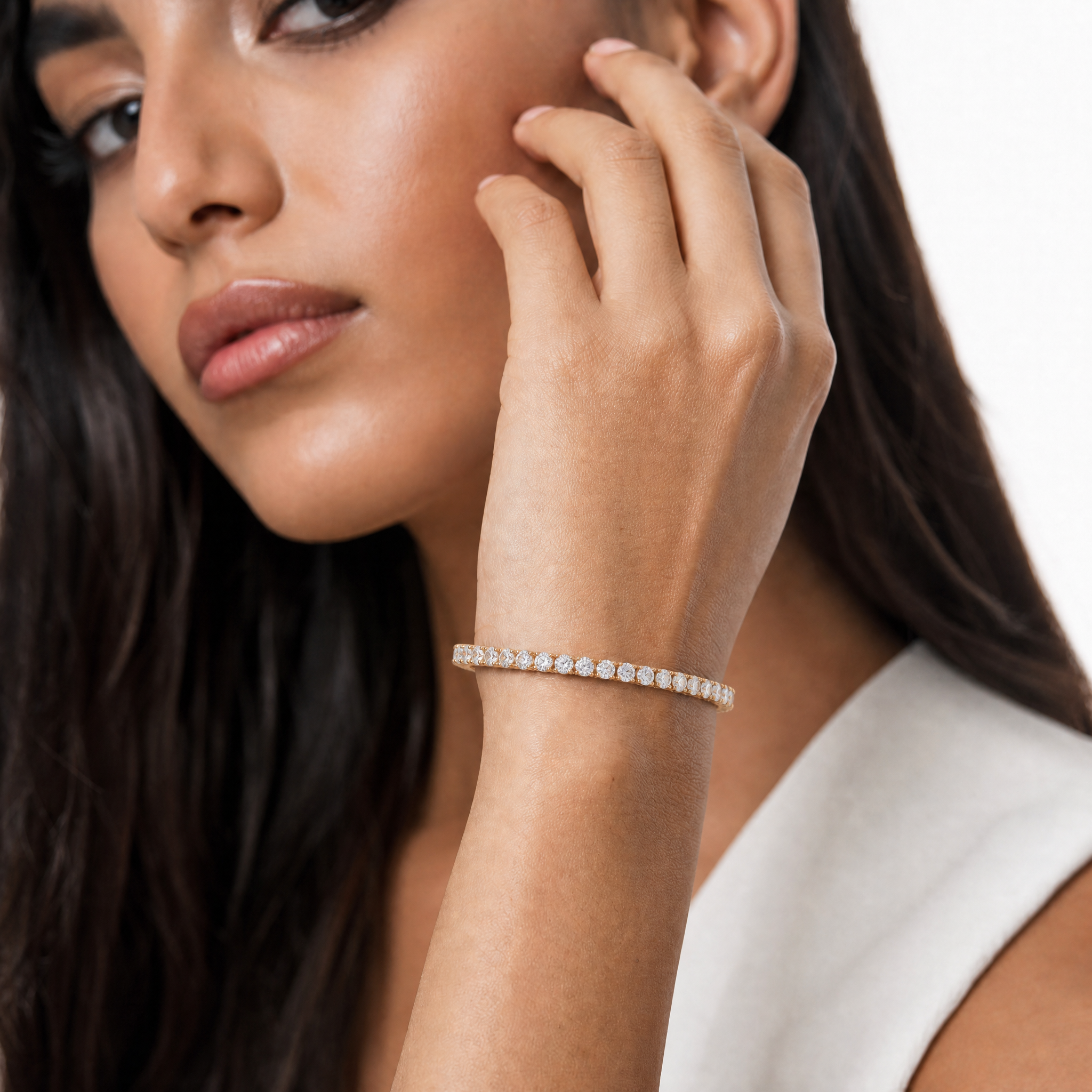 Luxury model wearing a 5 carat lab grown diamond tennis bracelet by Raul Diamonds with elegant wrist pose, refined styling, and soft luxury lighting